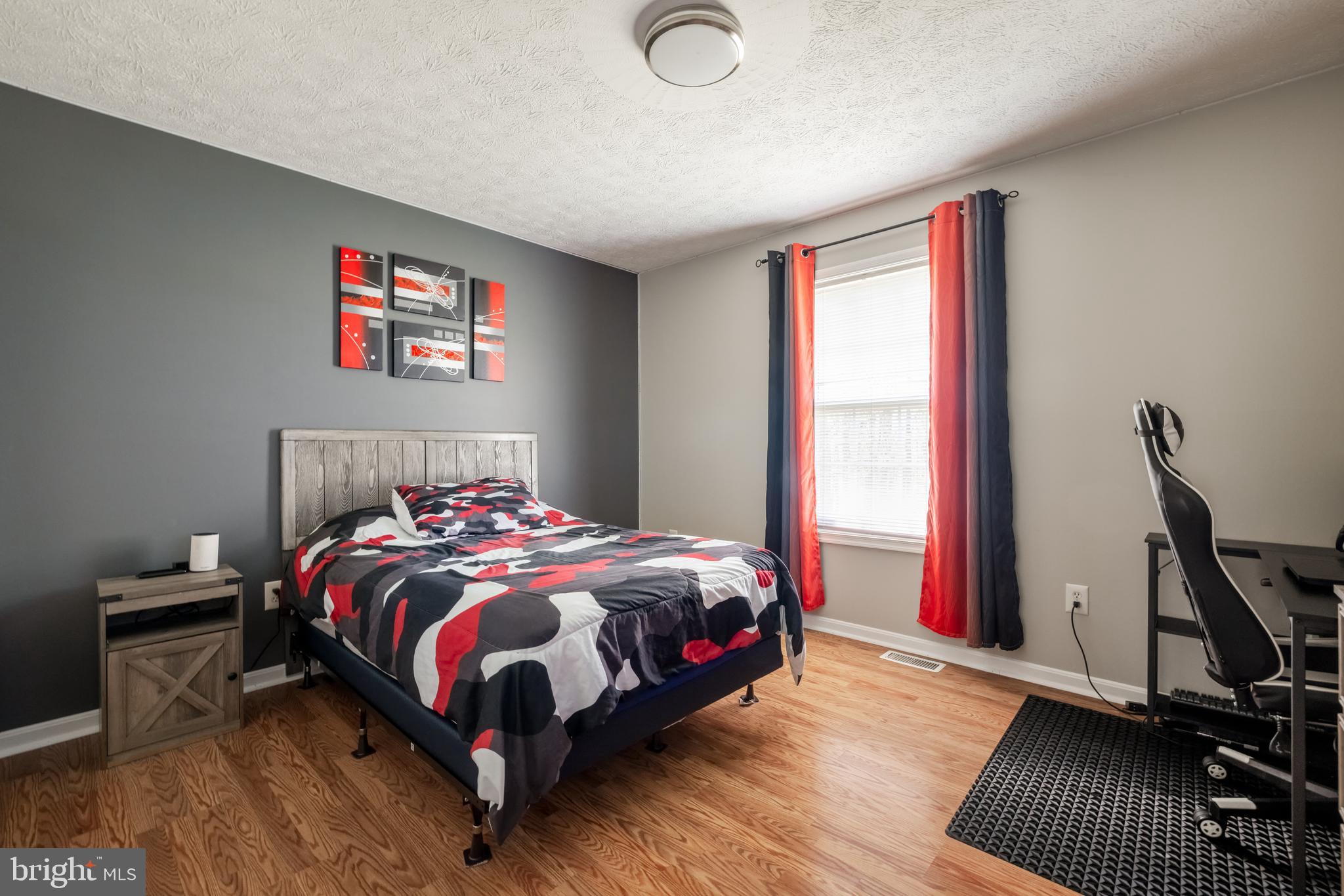 143 Club House Road Front Royal, VA 22630 - Photo 19 of 38 a bedroom with a bed and wooden floor