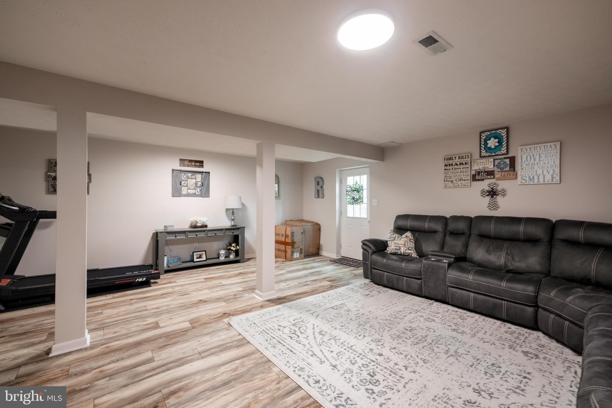 143 Club House Road Front Royal, VA 22630 - Photo 22 of 38 a living room with furniture and a wooden floor