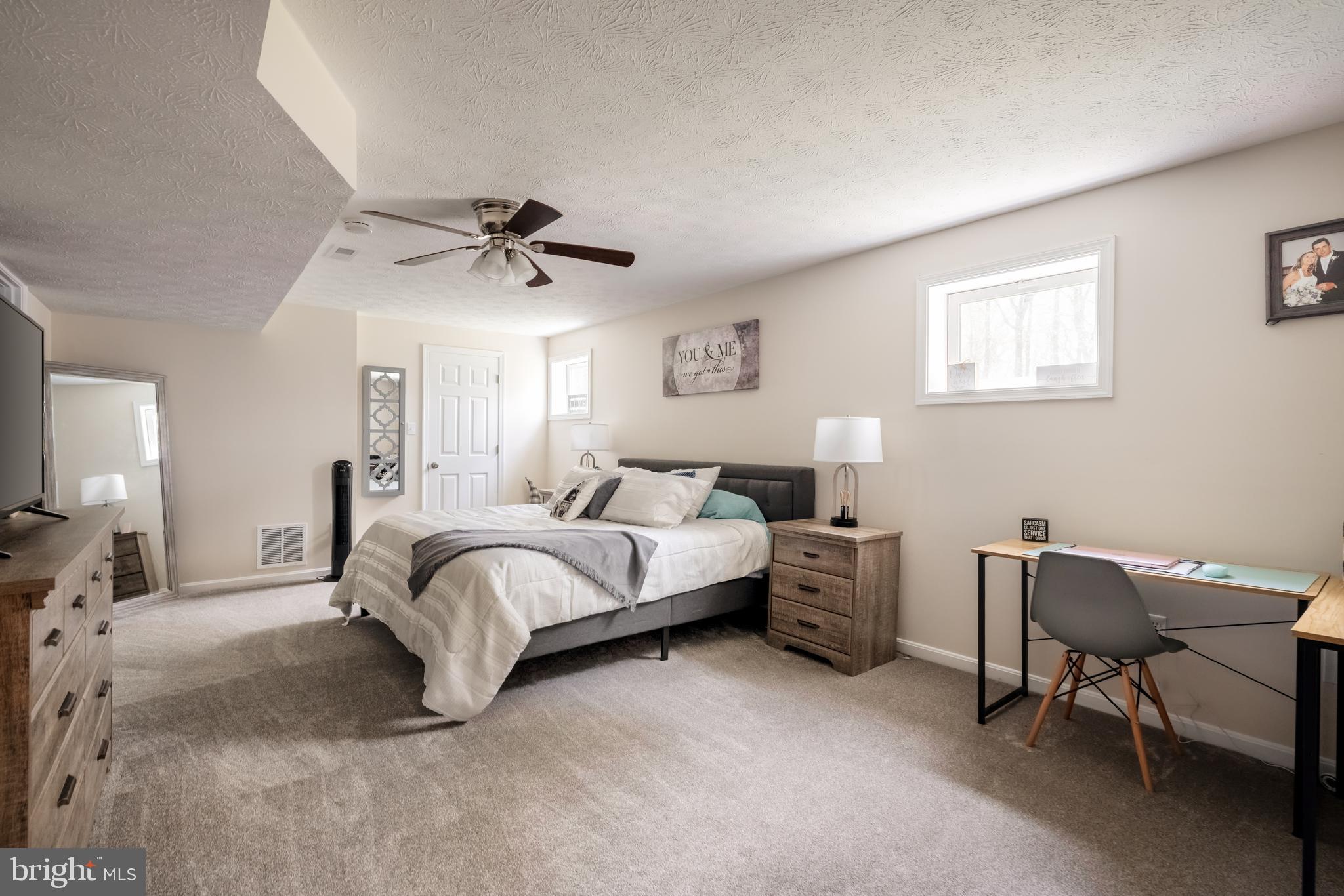 143 Club House Road Front Royal, VA 22630 - Photo 25 of 38 a spacious bedroom with a bed and a chair