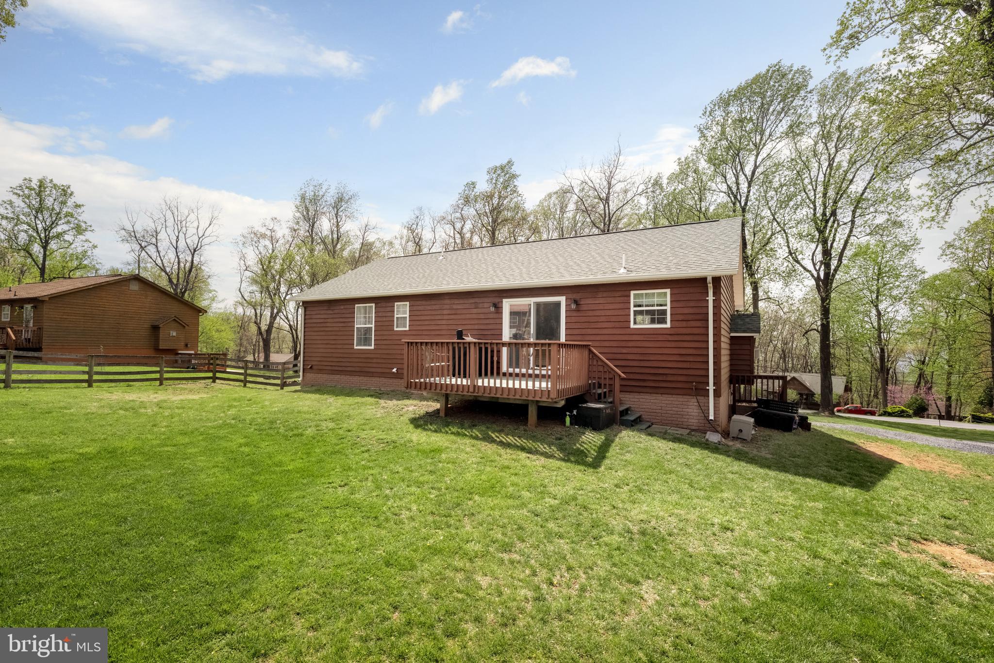 143 Club House Road Front Royal, VA 22630 - Photo 32 of 38 a backyard of a house with table and chairs
