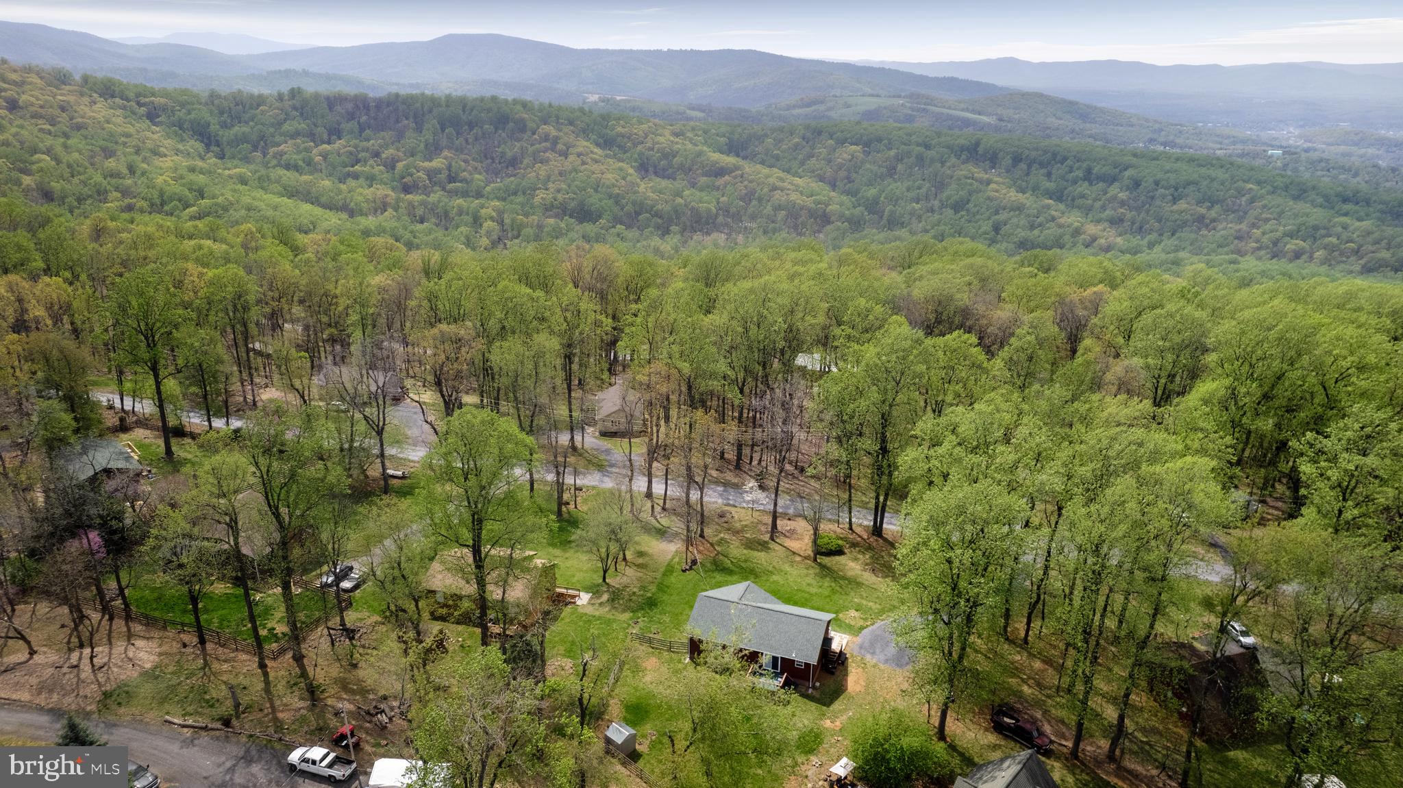 143 Club House Road Front Royal, VA 22630 - Photo 36 of 38 a view of a lush green forest with trees and some houses