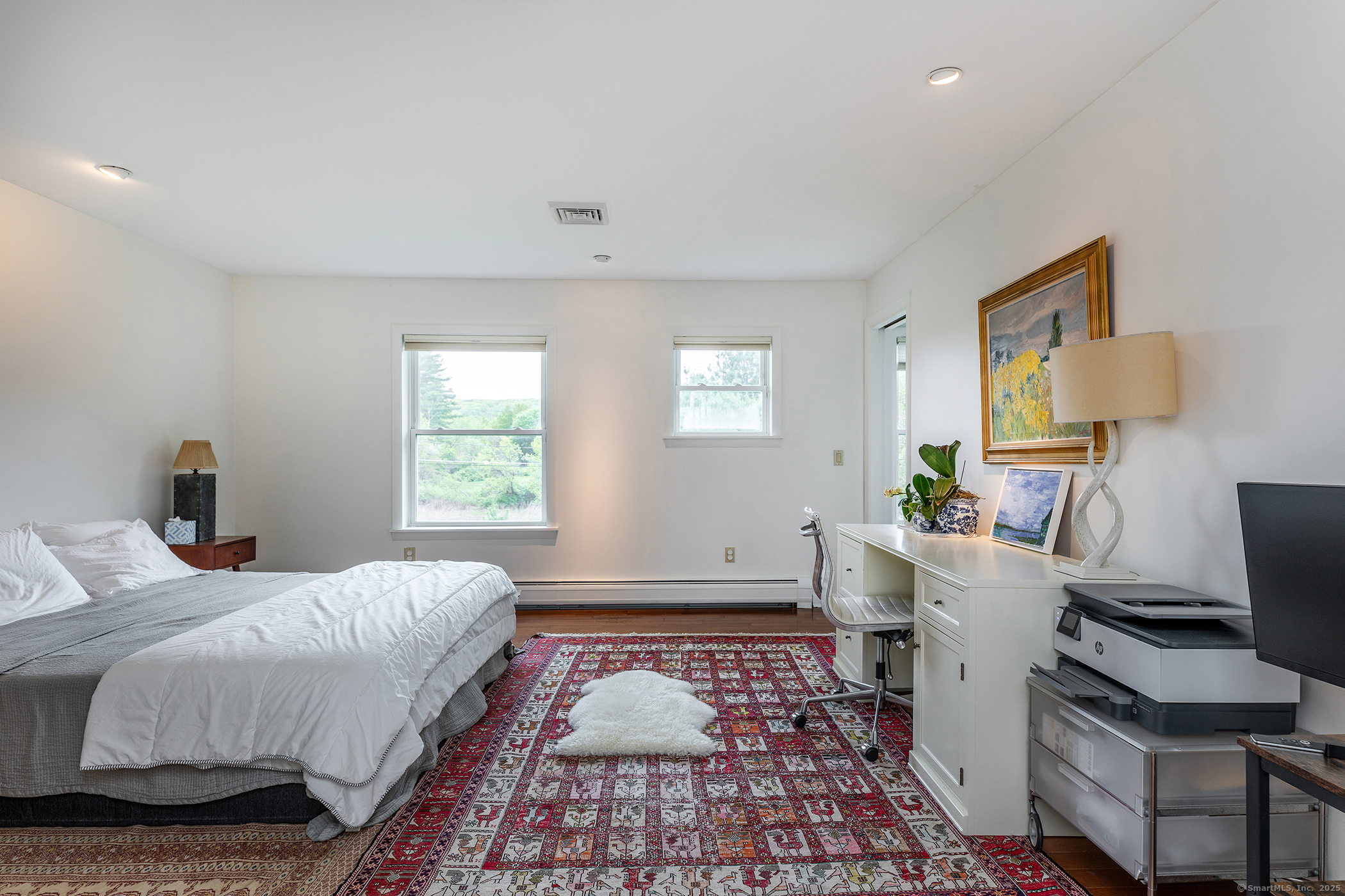 17 Rhynus Road Sharon, CT 06069 - Photo 17 of 30 a bedroom with a bed and wooden floor