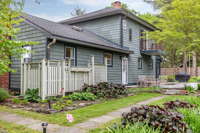 a front view of a house with garden