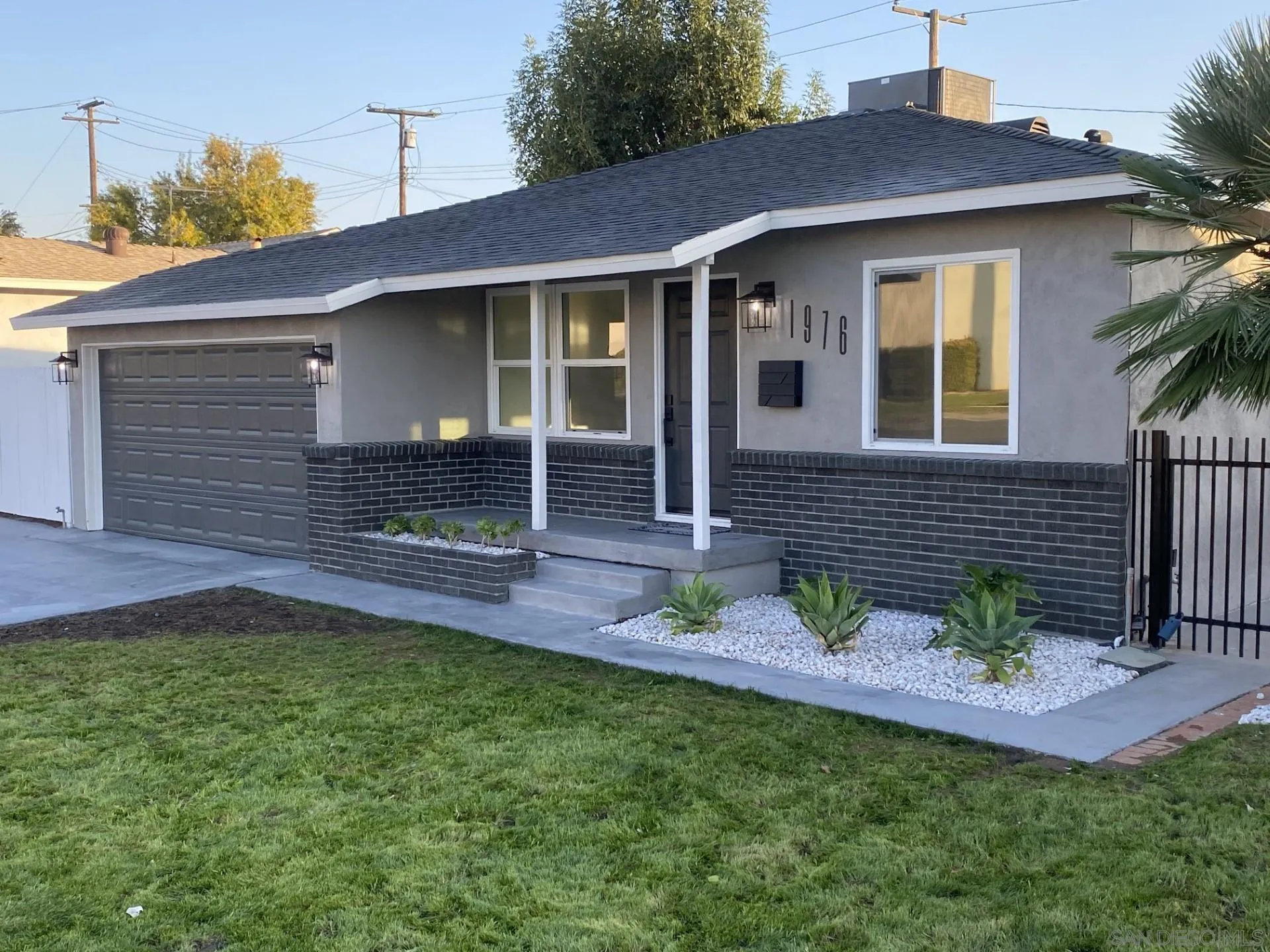 1976 3rd Street Riverside, CA 92507 - Photo 1 of 43 a front view of a house with a garden and plants