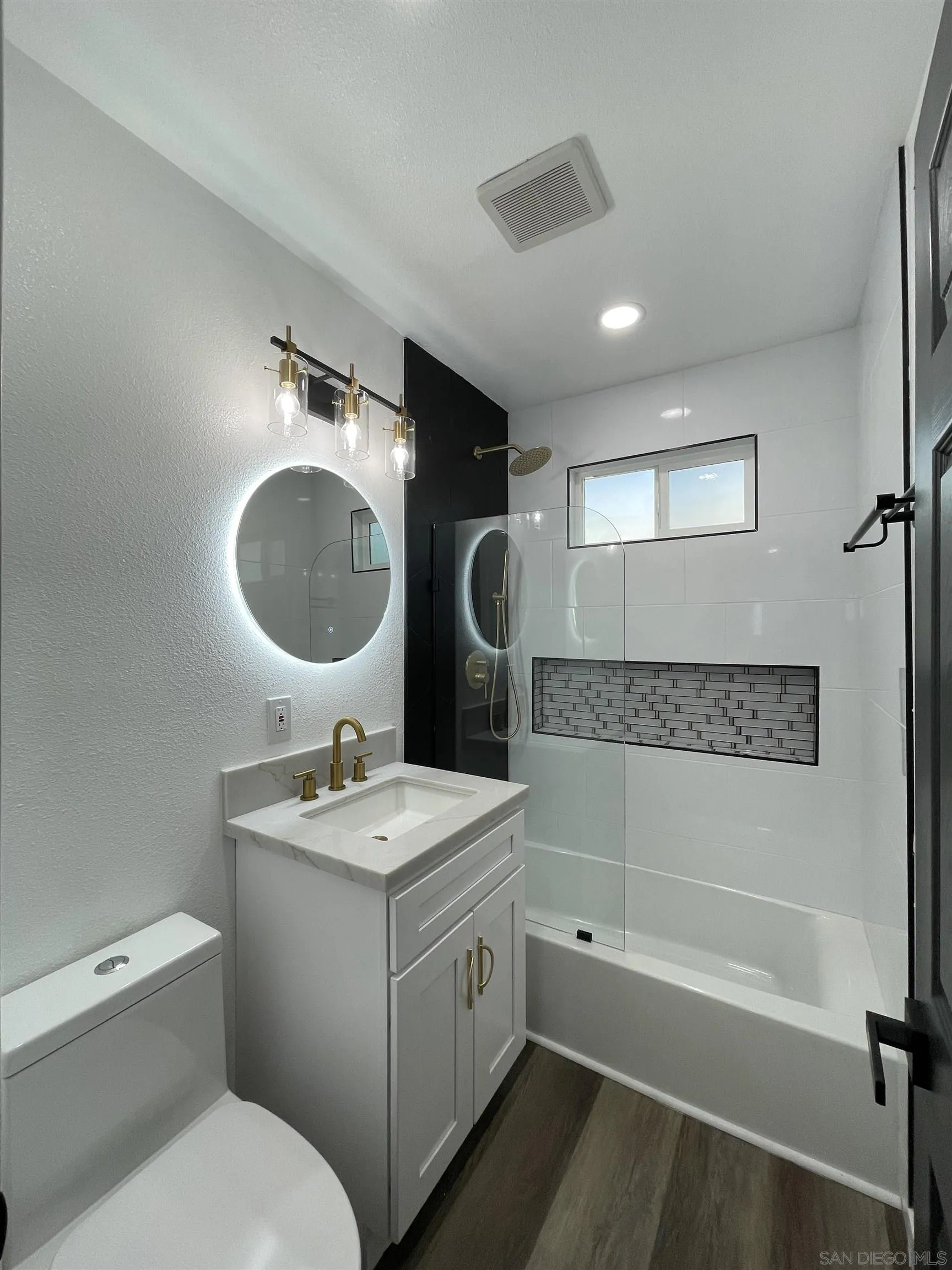 1976 3rd Street Riverside, CA 92507 - Photo 22 of 43 a bathroom with a toilet sink and mirror
