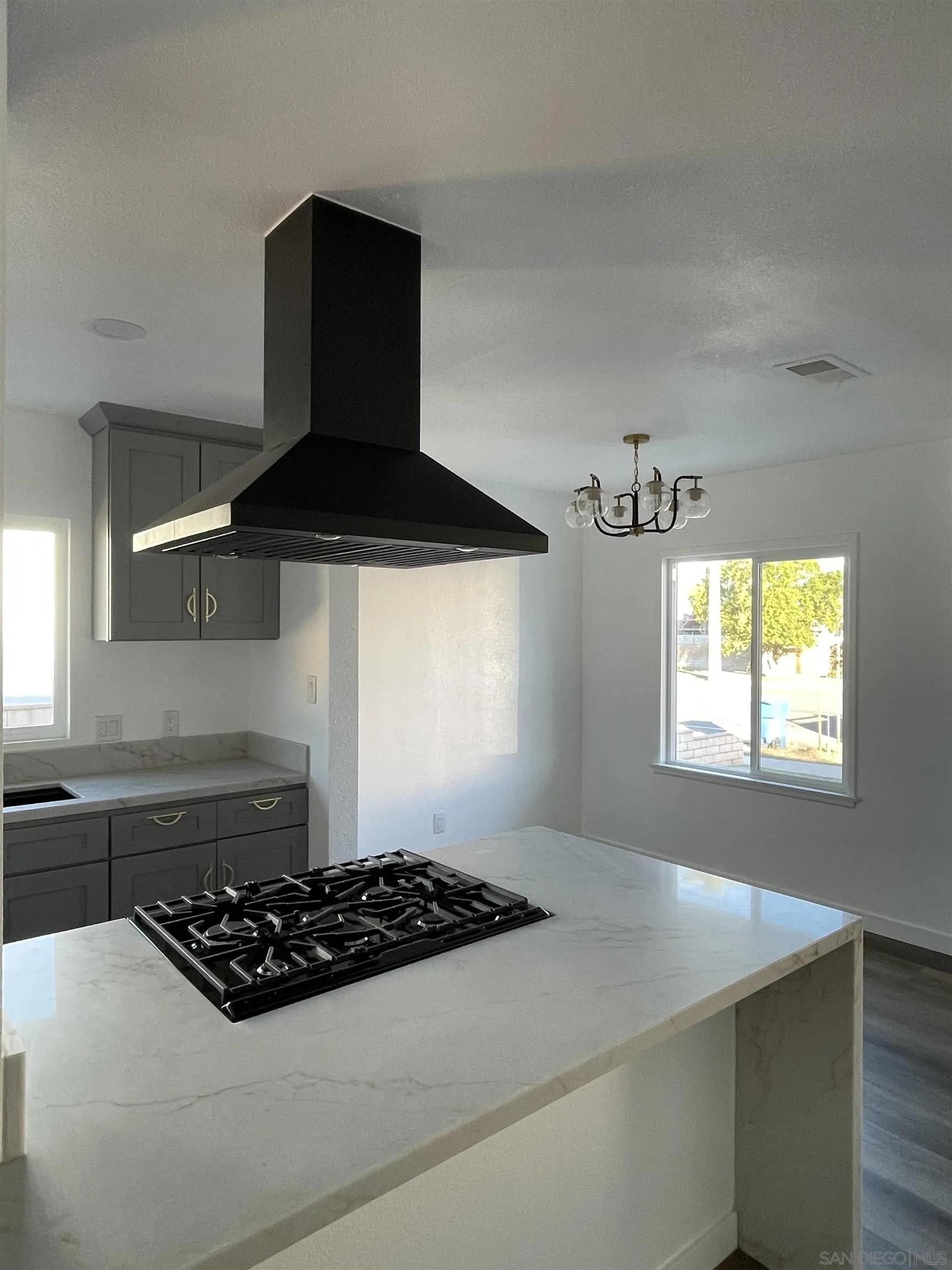 1976 3rd Street Riverside, CA 92507 - Photo 9 of 43 a kitchen with a stove and a cabinet