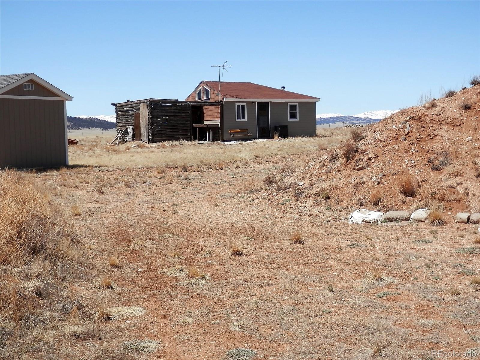 a view of a house with a snow in the yard