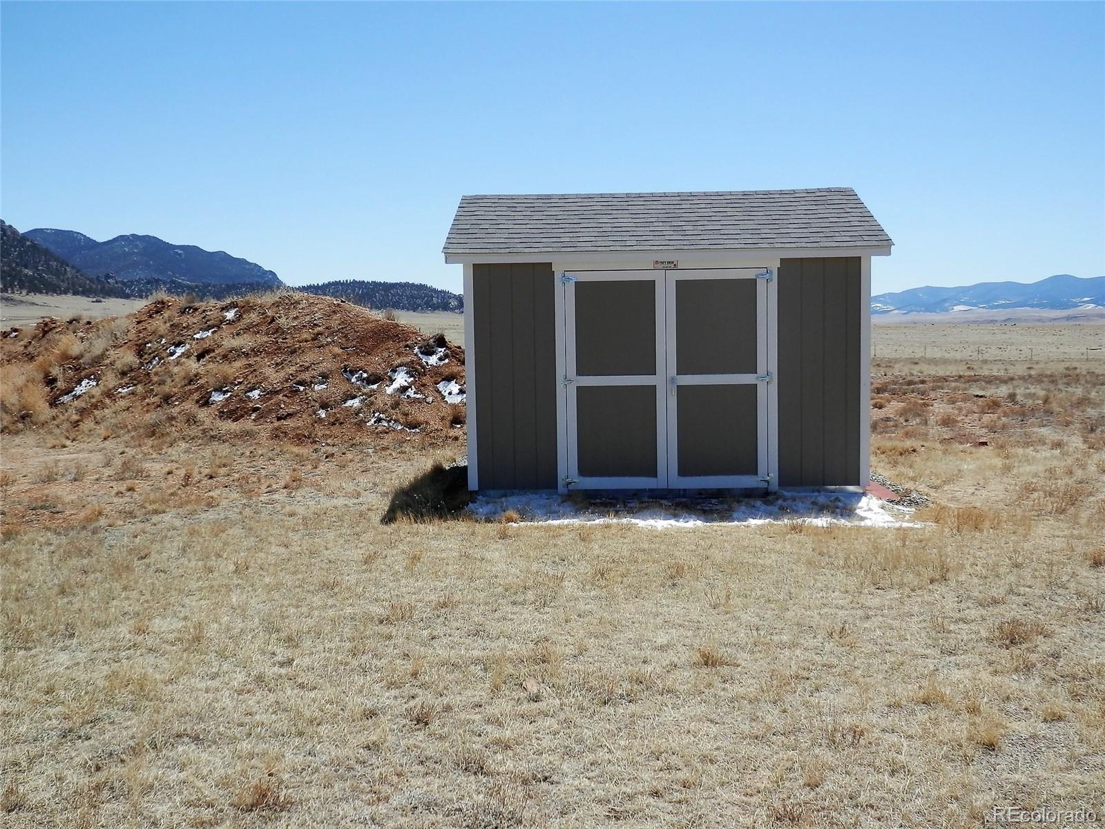 845 Montoya Road Lake George, CO 80827 - Photo 16 of 35 a view of a house with a yard