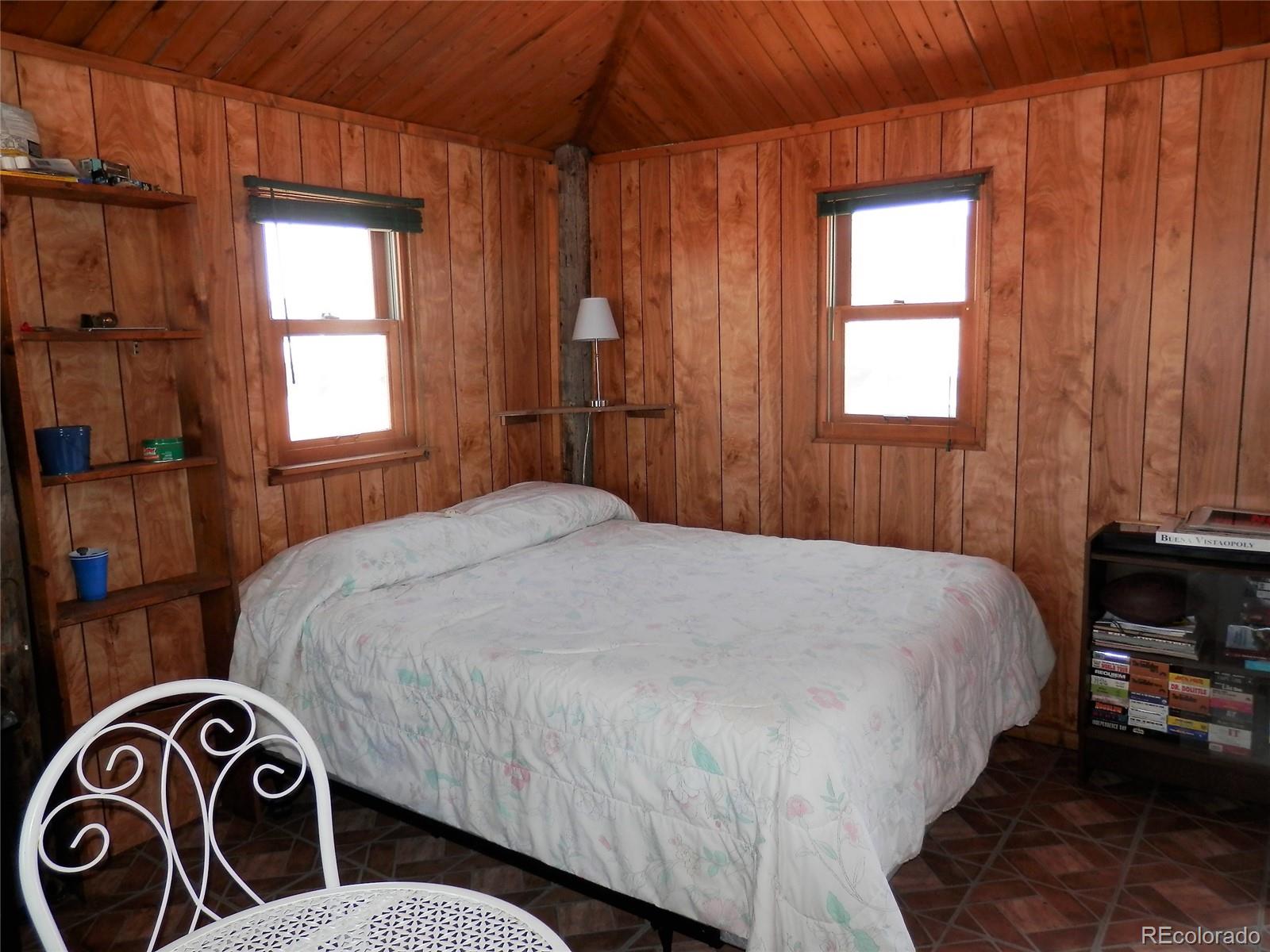 845 Montoya Road Lake George, CO 80827 - Photo 6 of 35 a bedroom with a bed and a window
