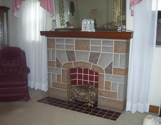 34 Rumbaugh Avenue Mount Pleasant, PA 15666 - Photo 4 of 17 Living Room. FIRE PLACE WITH MANTEL AND ELECTRIC LOGS