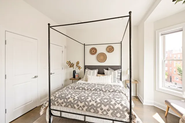 a bed room with a bed and a window