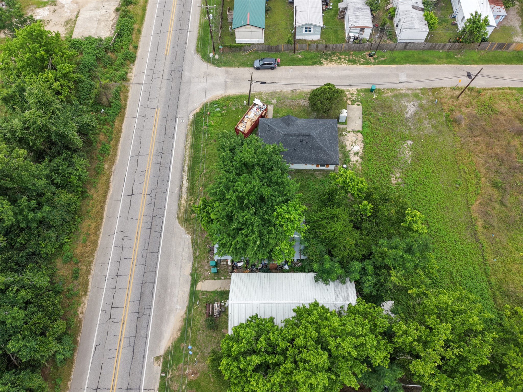 0 Mill Street Willis, TX 77378 - Photo 24 of 24 an aerial view of a house with a yard and lake view