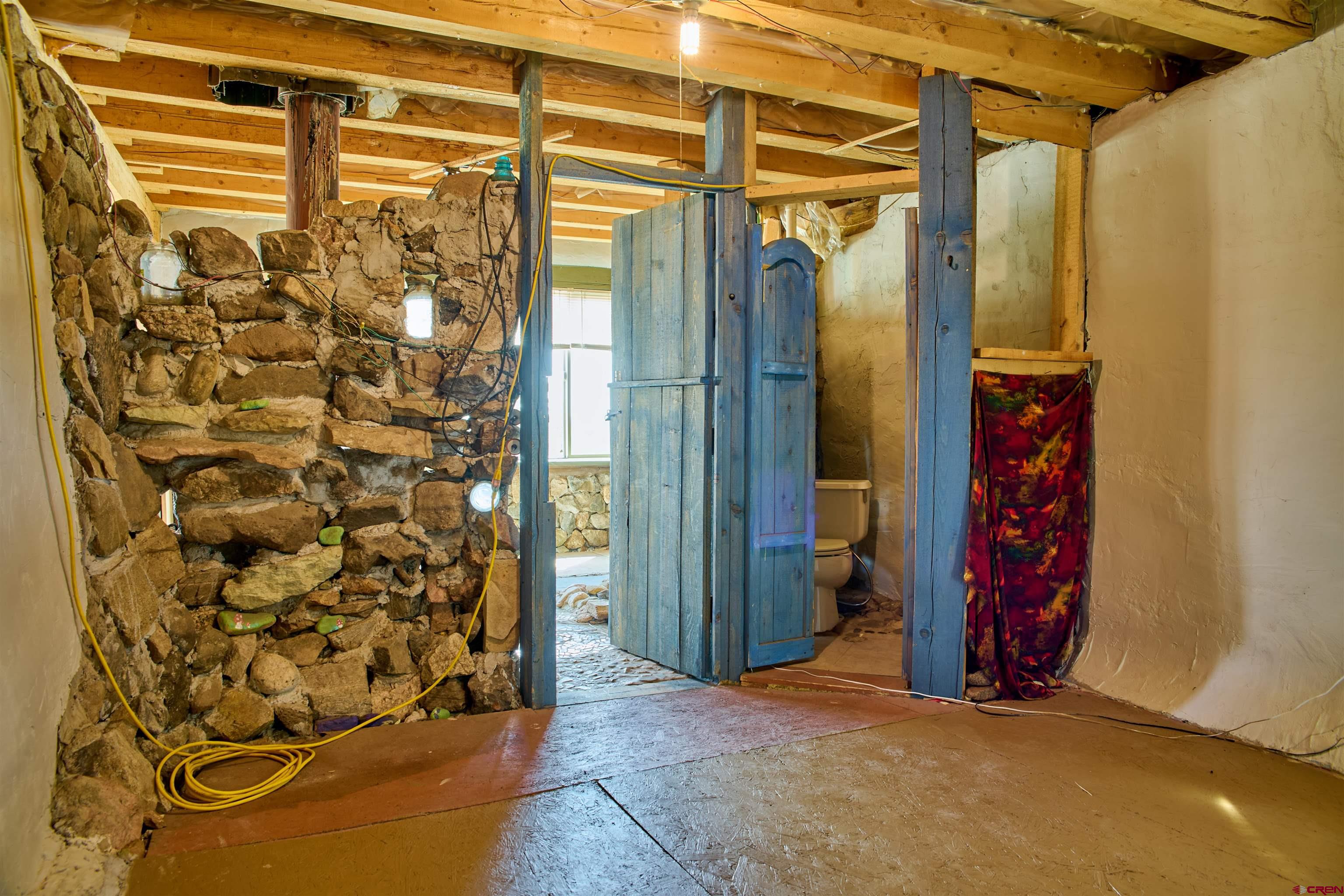 1380 Dunn Road Fort Garland, CO 81133 - Photo 13 of 45 a view of an front door and wooden floor