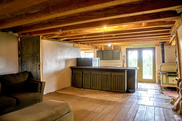 a view of a living room and a wooden floor