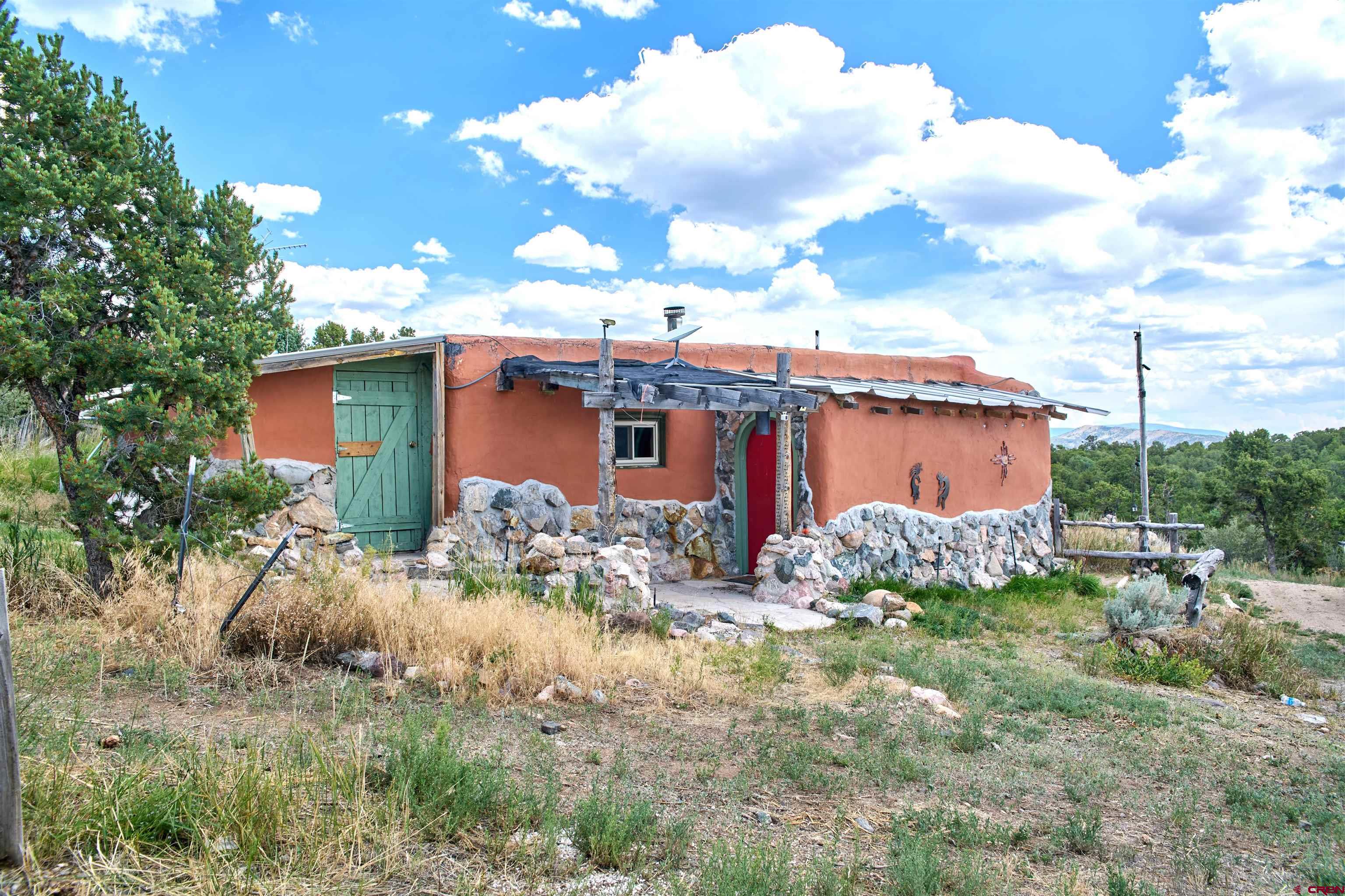 1380 Dunn Road Fort Garland, CO 81133 - Photo 26 of 45 a view of a house with a yard