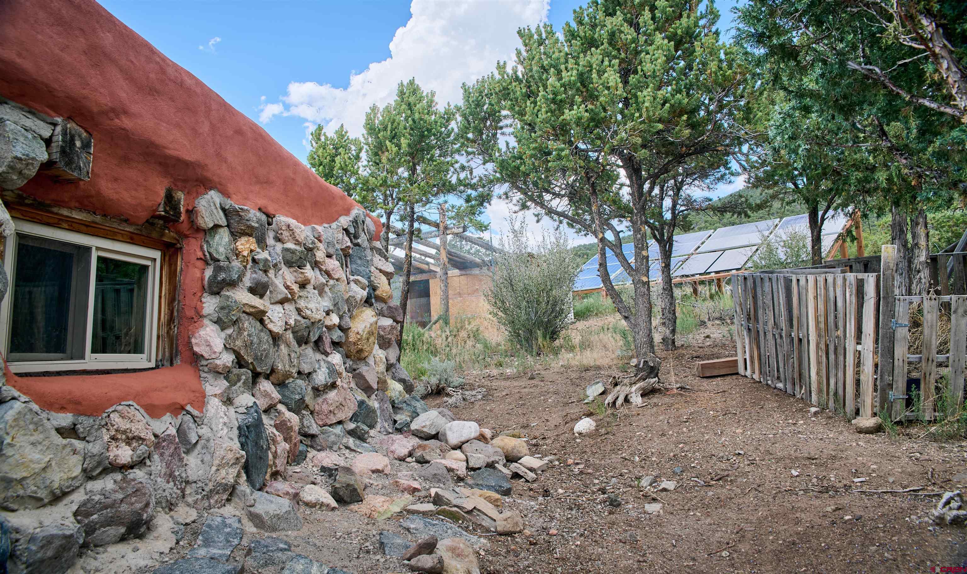 1380 Dunn Road Fort Garland, CO 81133 - Photo 28 of 45 a backyard of a house with lots of green space