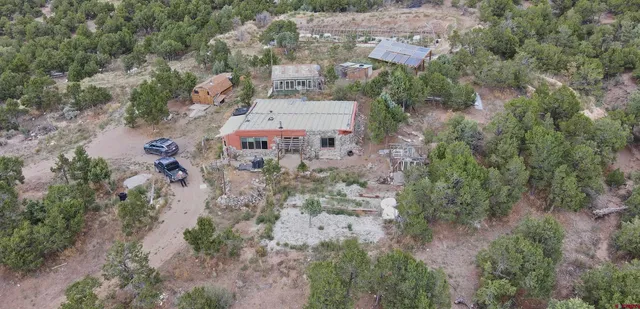 an aerial view of a houses with outdoor space and street view