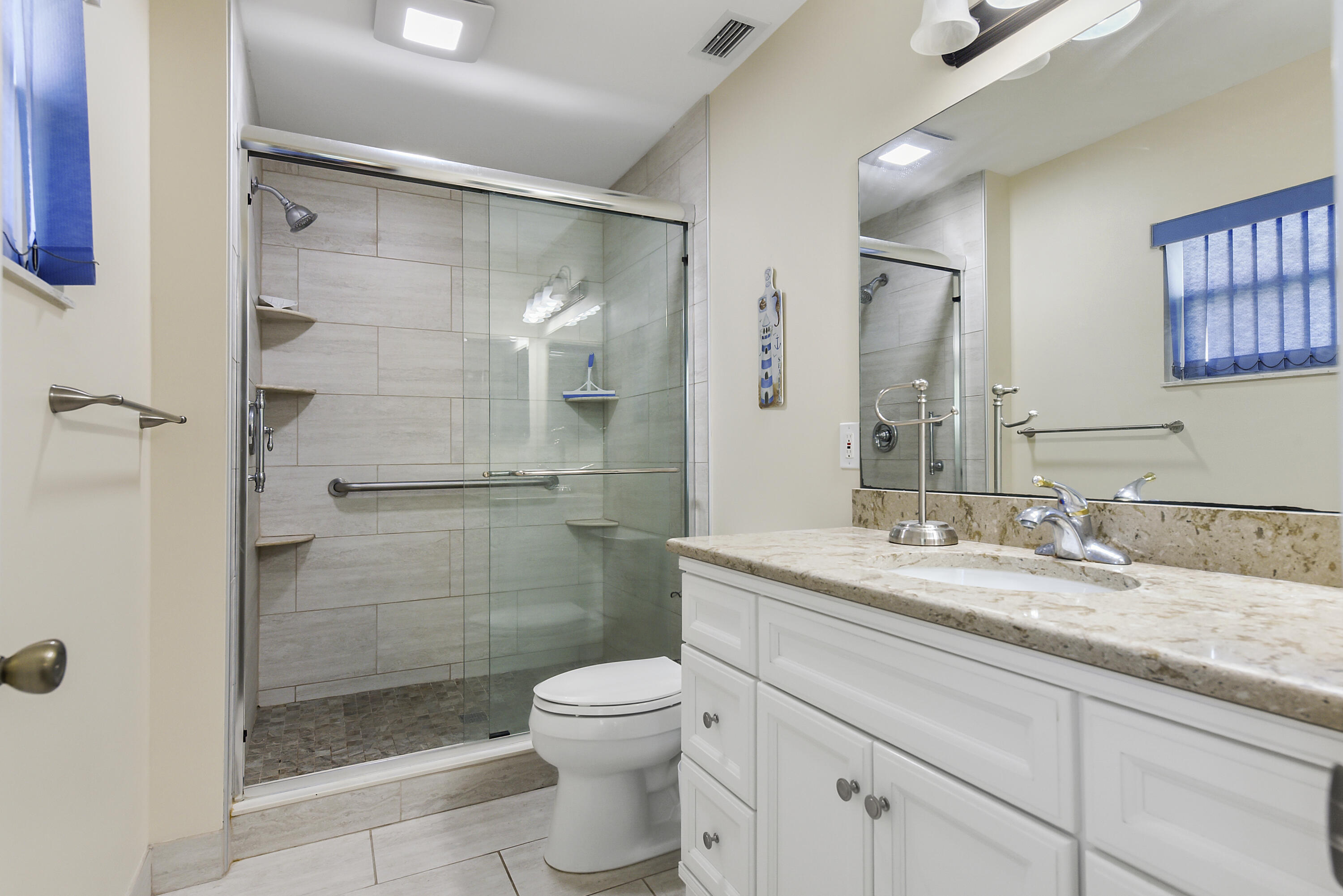 6940 Southeast Lillian Court Stuart, FL 34997 - Photo 17 of 28 Primary Bath