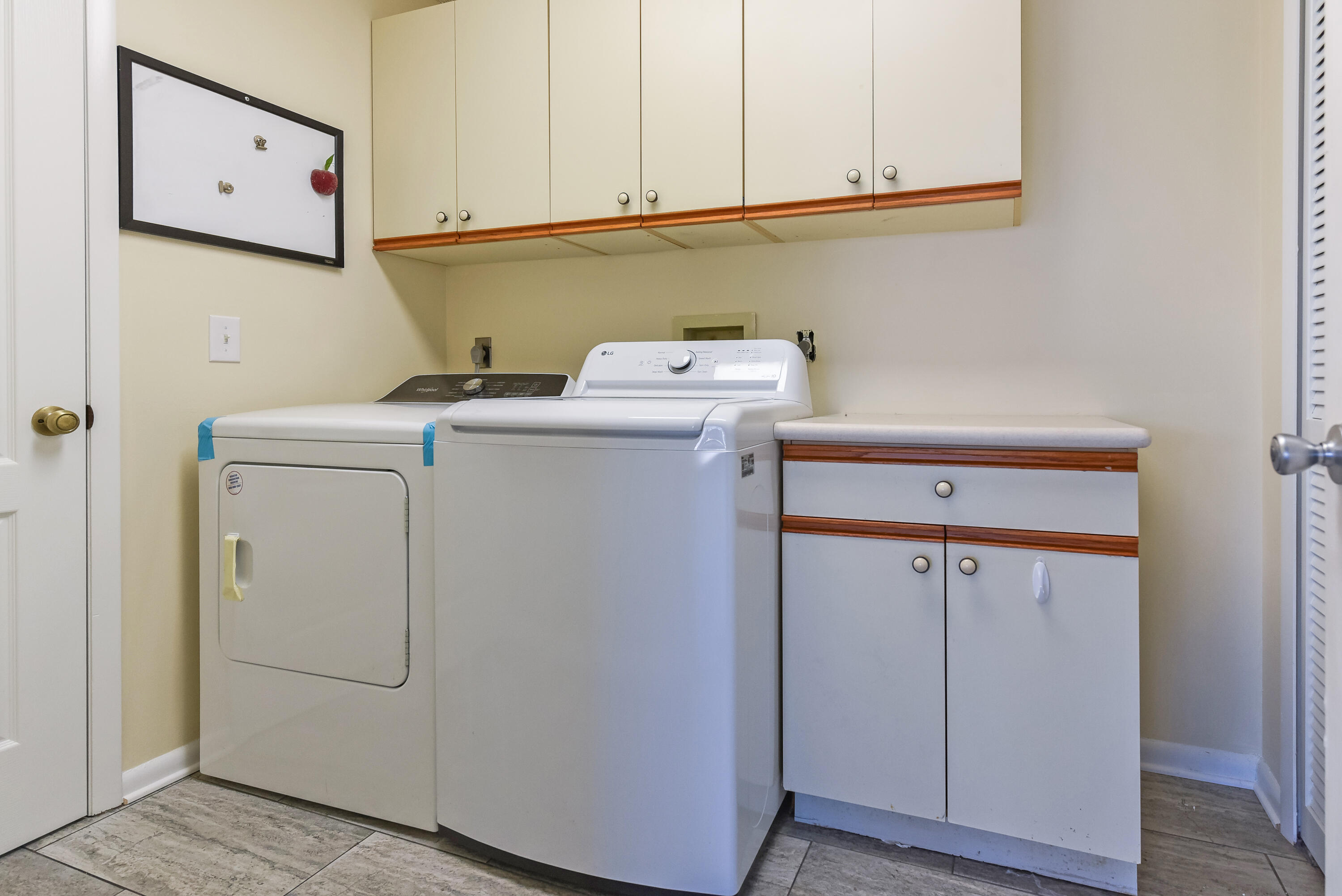6940 Southeast Lillian Court Stuart, FL 34997 - Photo 22 of 28 Inside washer/dryer