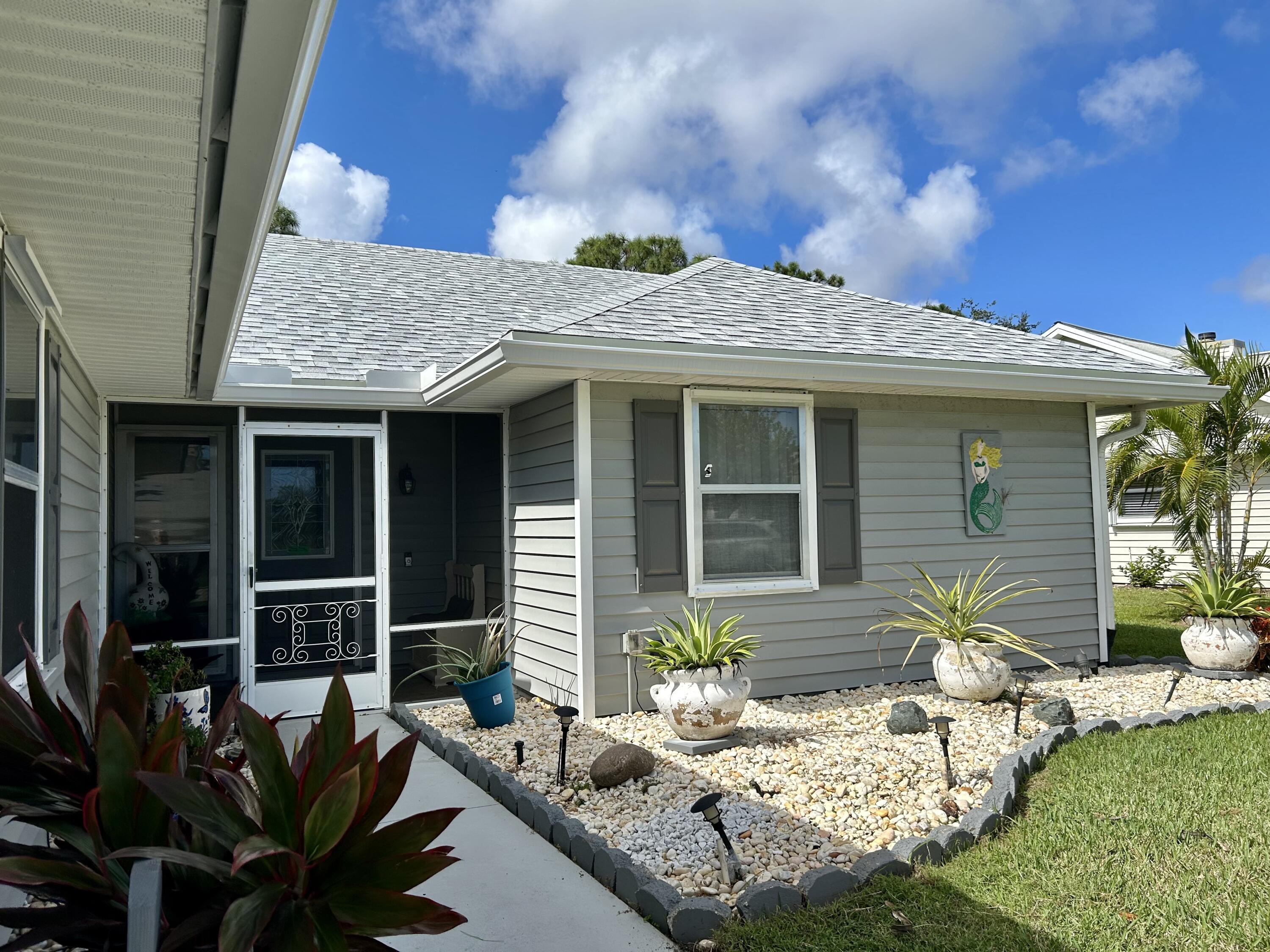 6940 Southeast Lillian Court Stuart, FL 34997 - Photo 3 of 28 Scr porch entry