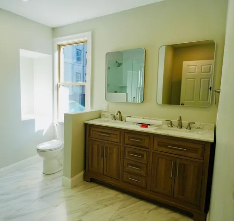 a bathroom with a bath tub and shower