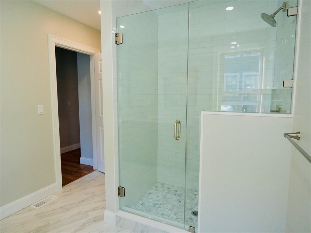 59 7th Street Cambridge, MA 02141 - Photo 14 of 21 a bathroom with a shower and a sink