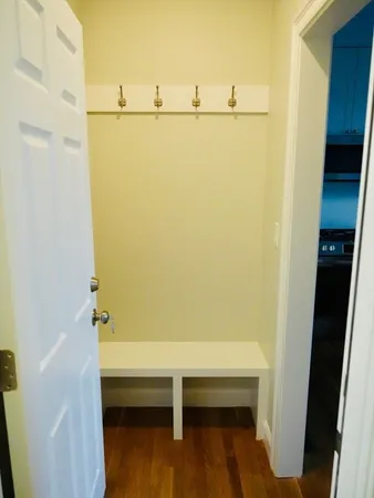 a bathroom with a shower and a table