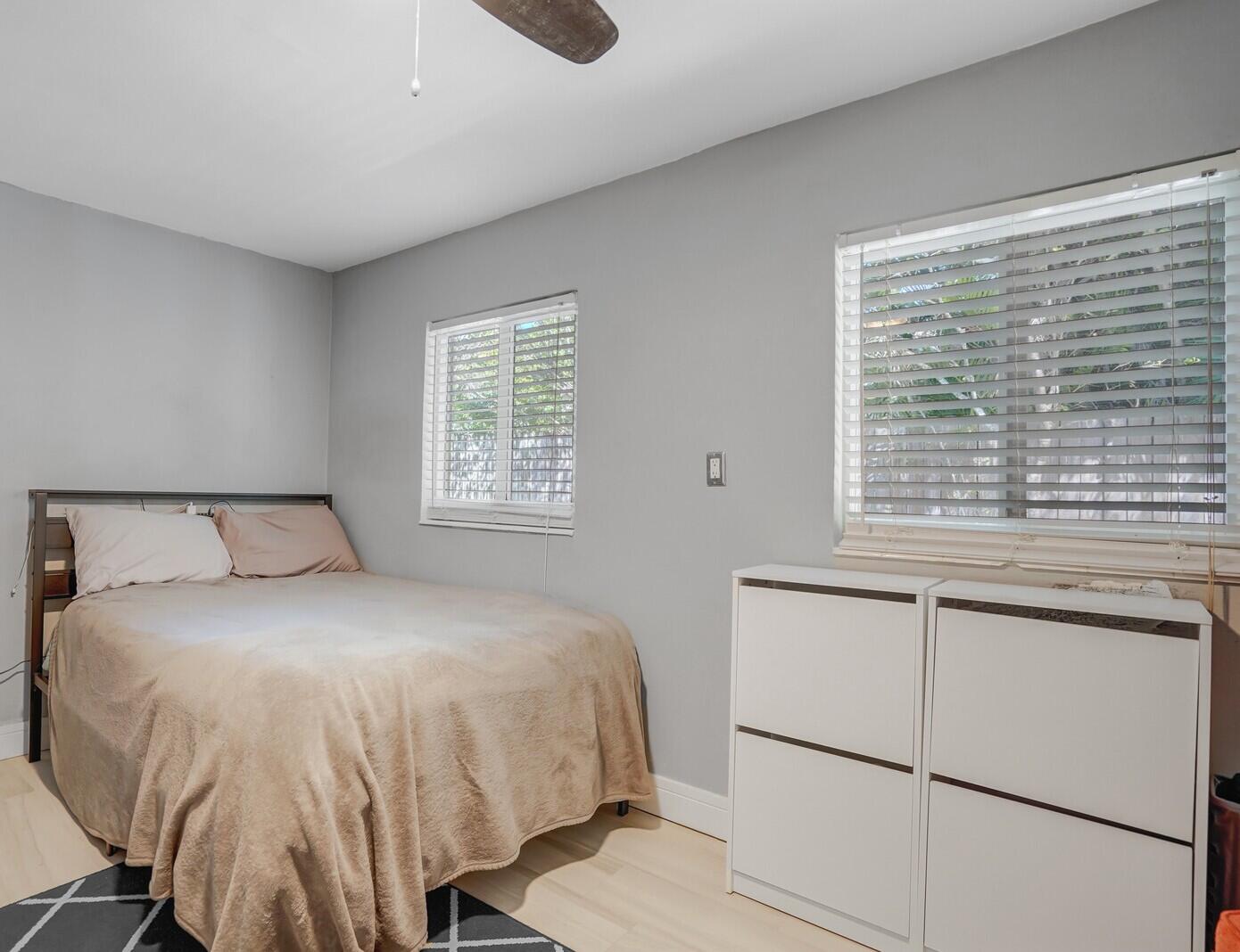 3098 Northeast 5th Avenue Boca Raton, FL 33431 - Photo 11 of 28 a bedroom with a bed and a window