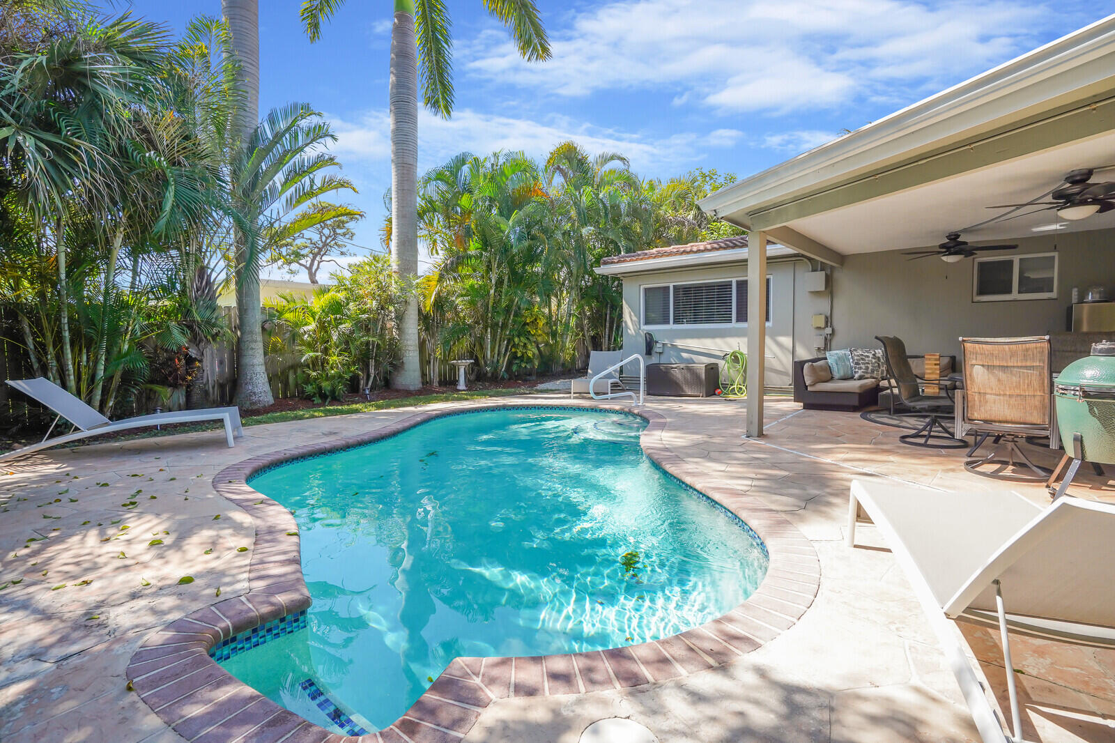 3098 Northeast 5th Avenue Boca Raton, FL 33431 - Photo 18 of 28 a front view of a house with garden
