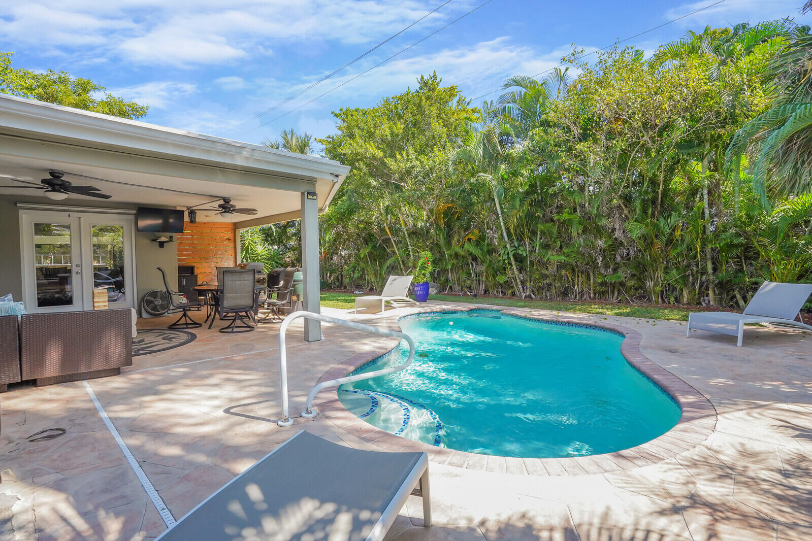 3098 Northeast 5th Avenue Boca Raton, FL 33431 - Photo 20 of 28 a swimming pool with outdoor seating and garden