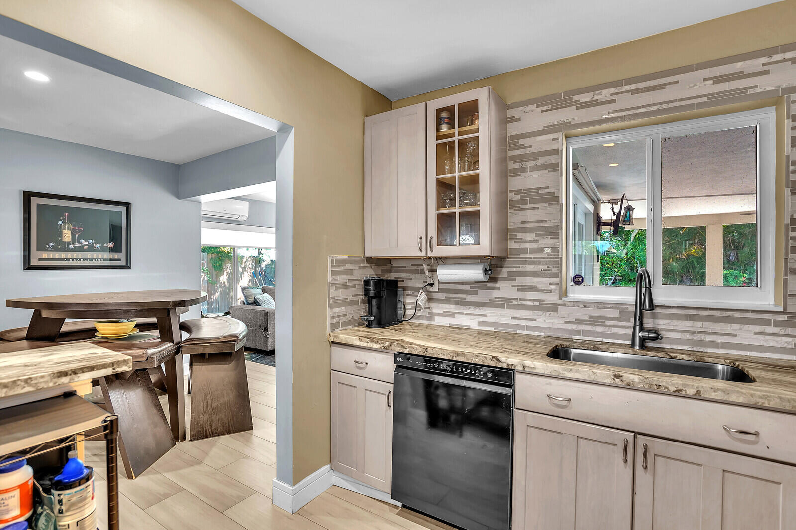 3098 Northeast 5th Avenue Boca Raton, FL 33431 - Photo 8 of 28 a kitchen with a sink stove and cabinets