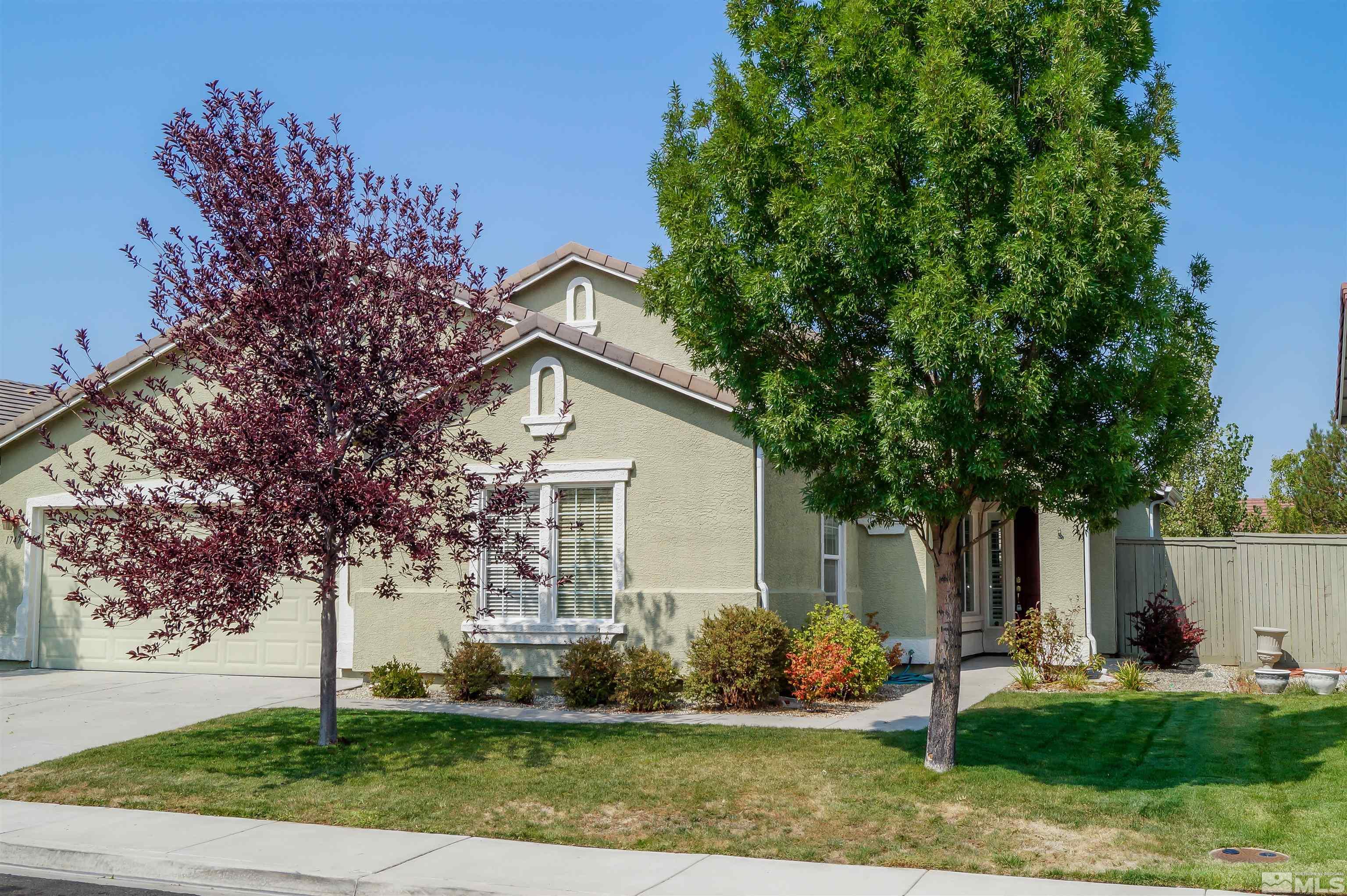 1747 Canyon Shadow Circle Reno, NV 89521 - Photo 3 of 14 a front view of a house with garden