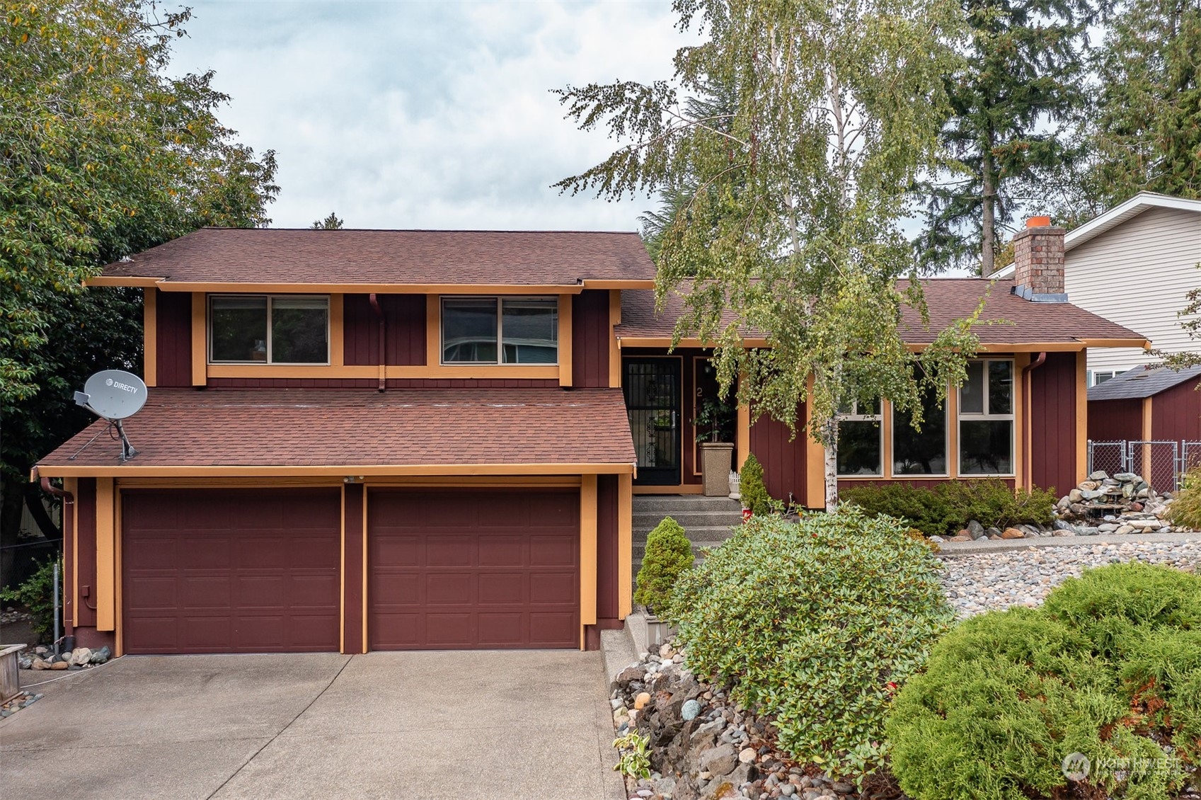 2960 Delphi Loop Northeast Bremerton, WA 98311 - Photo 1 of 1 a front view of a house with a garden