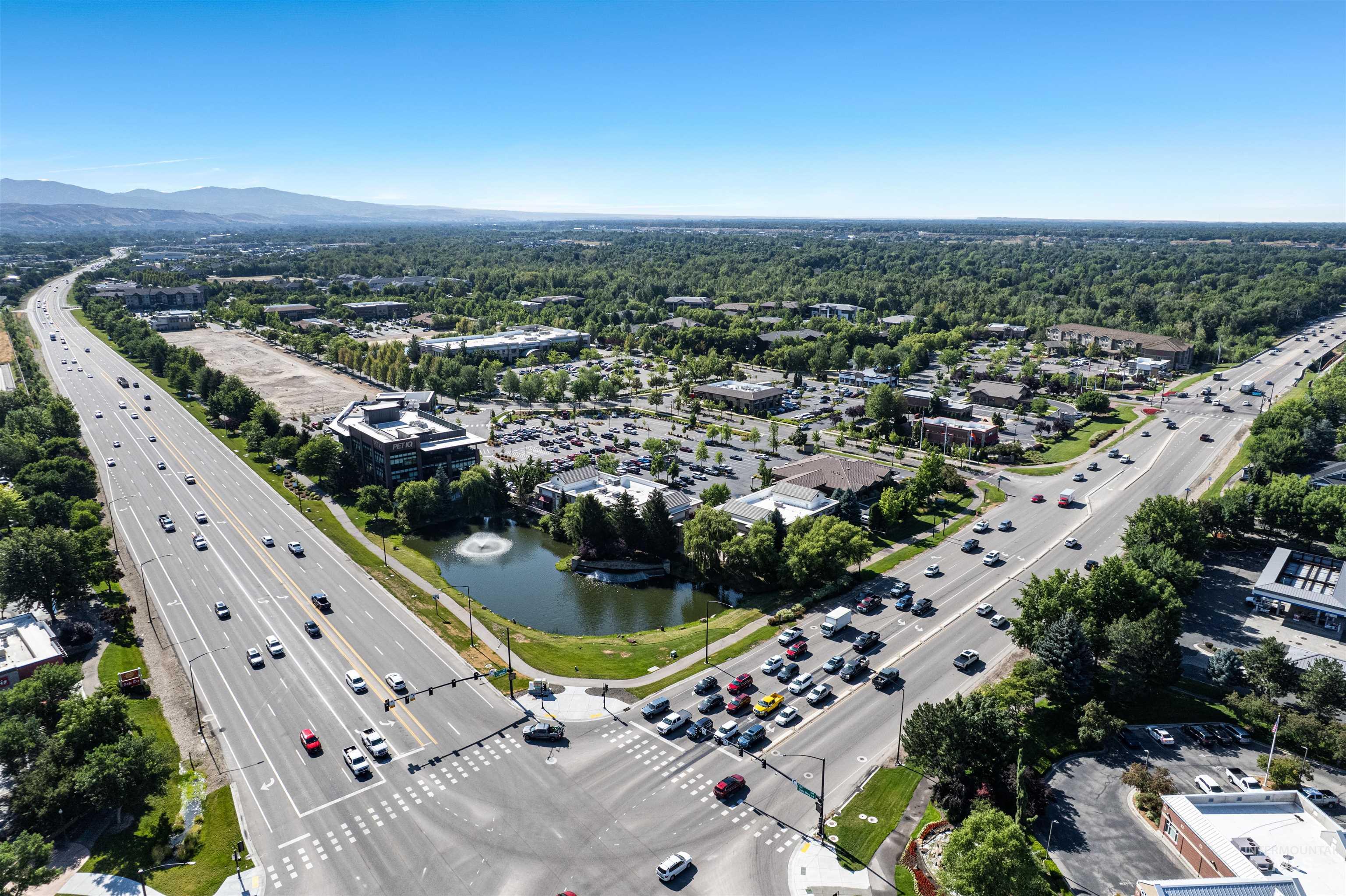 348 North Eagle Road Eagle, ID 83616 - Photo 31 of 31 Drone / aerial view of a major roadway and a water and mountain view