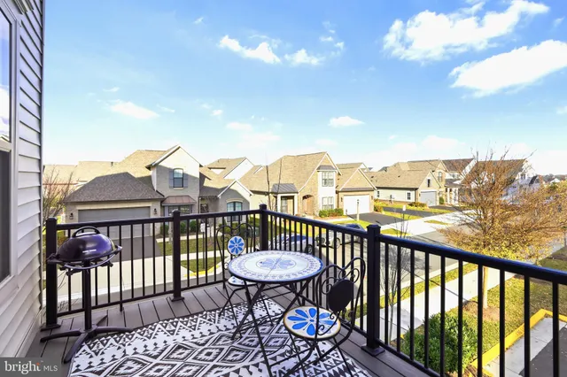 a view of a chairs and table in patio