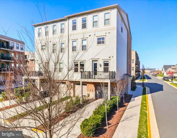 a view of a large building with a swimming pool