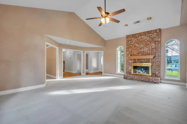 an aerial view of a house with outdoor space
