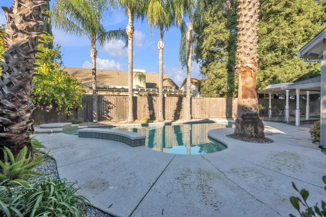 a bathroom with a sink a toilet and a window
