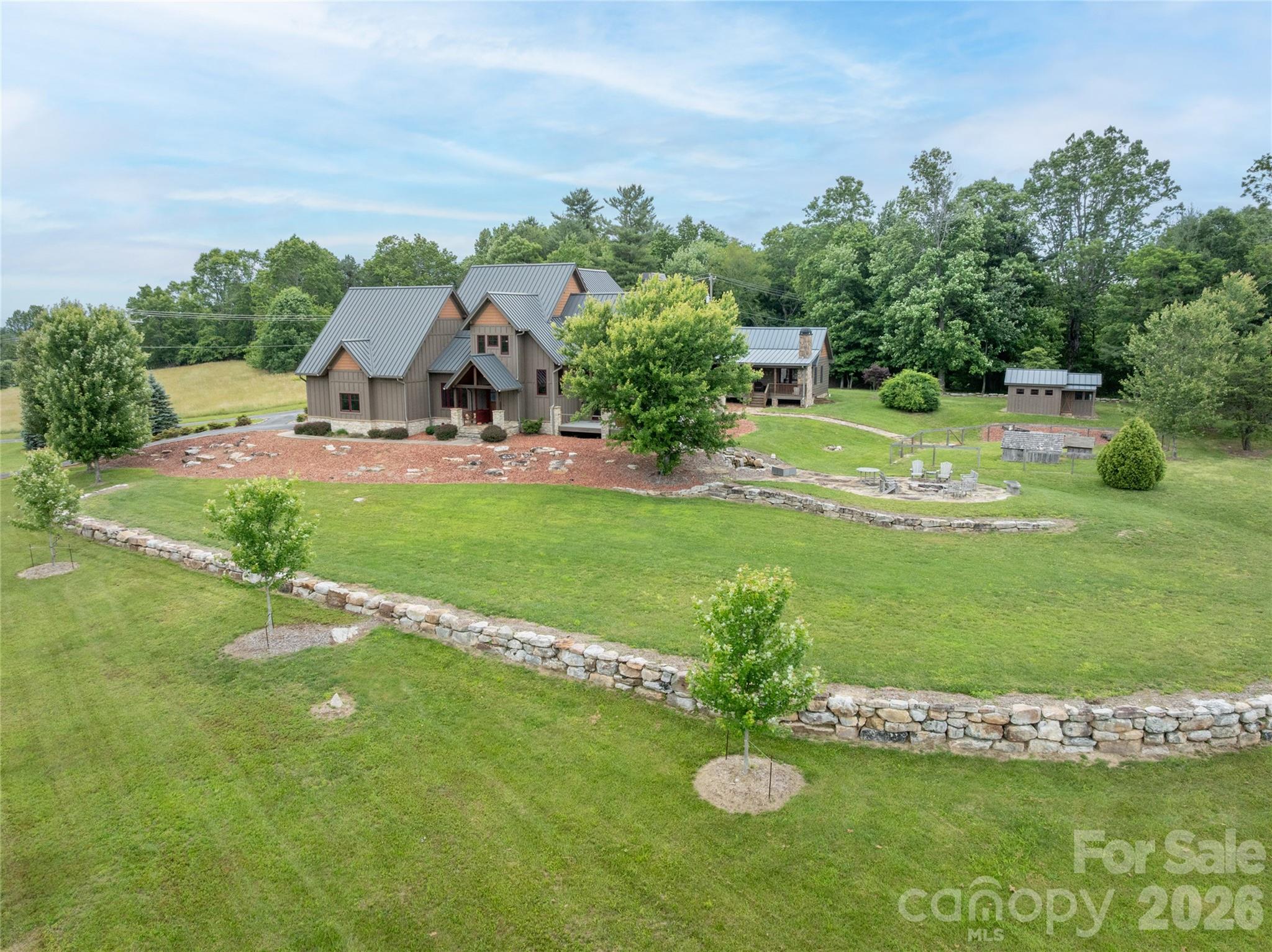 4862 Pinnacle Mountain Road Zirconia, NC 28790 - Photo 1 of 38 a view of a garden with a fountain