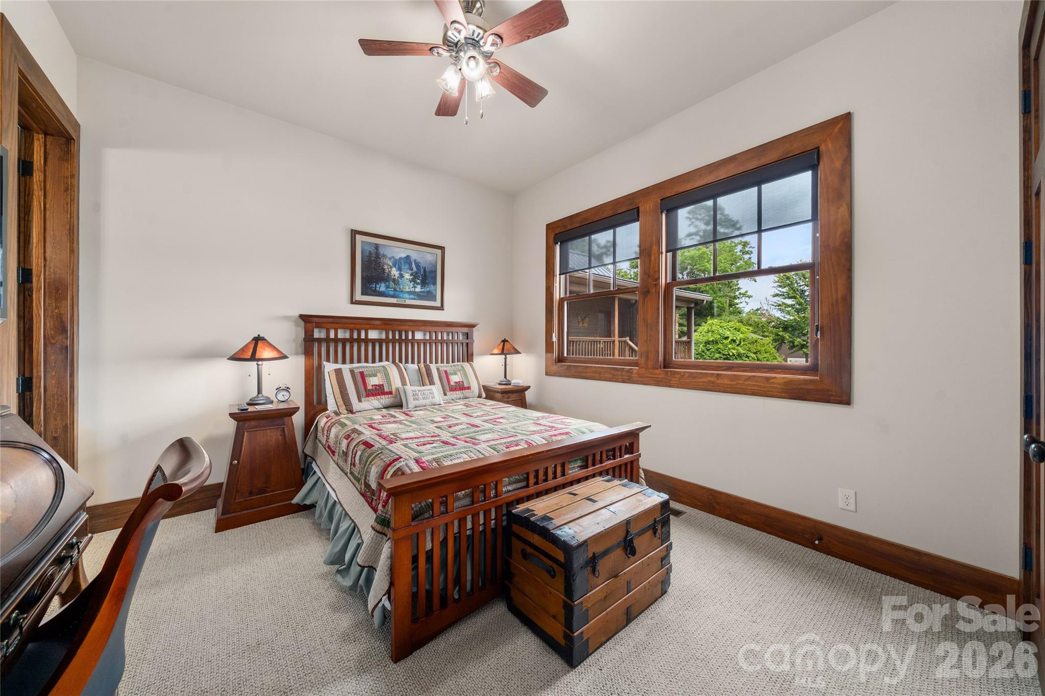4862 Pinnacle Mountain Road Zirconia, NC 28790 - Photo 13 of 38 a bedroom with a bed table and a window