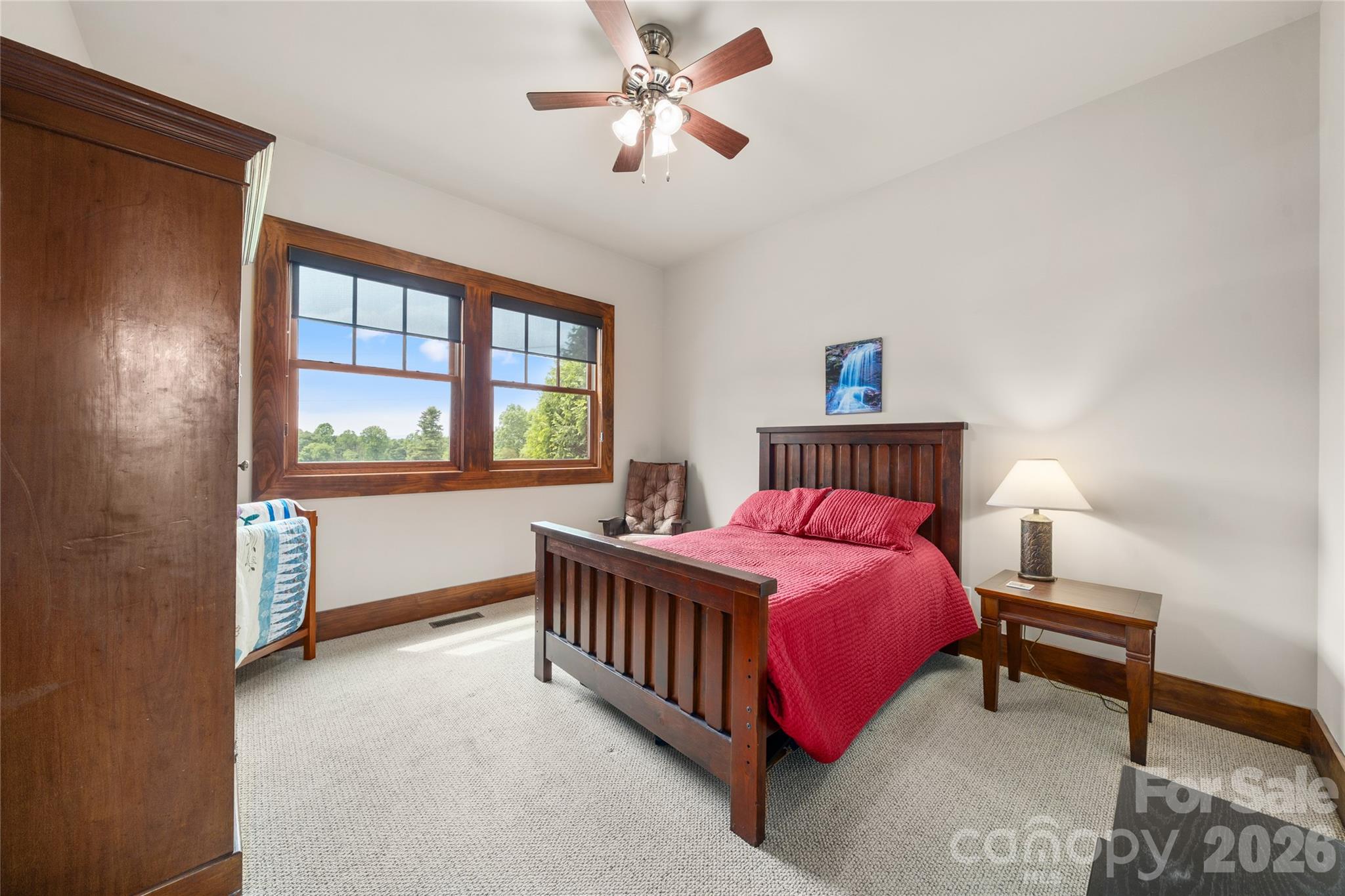 4862 Pinnacle Mountain Road Zirconia, NC 28790 - Photo 14 of 38 a bedroom with a bed and a window
