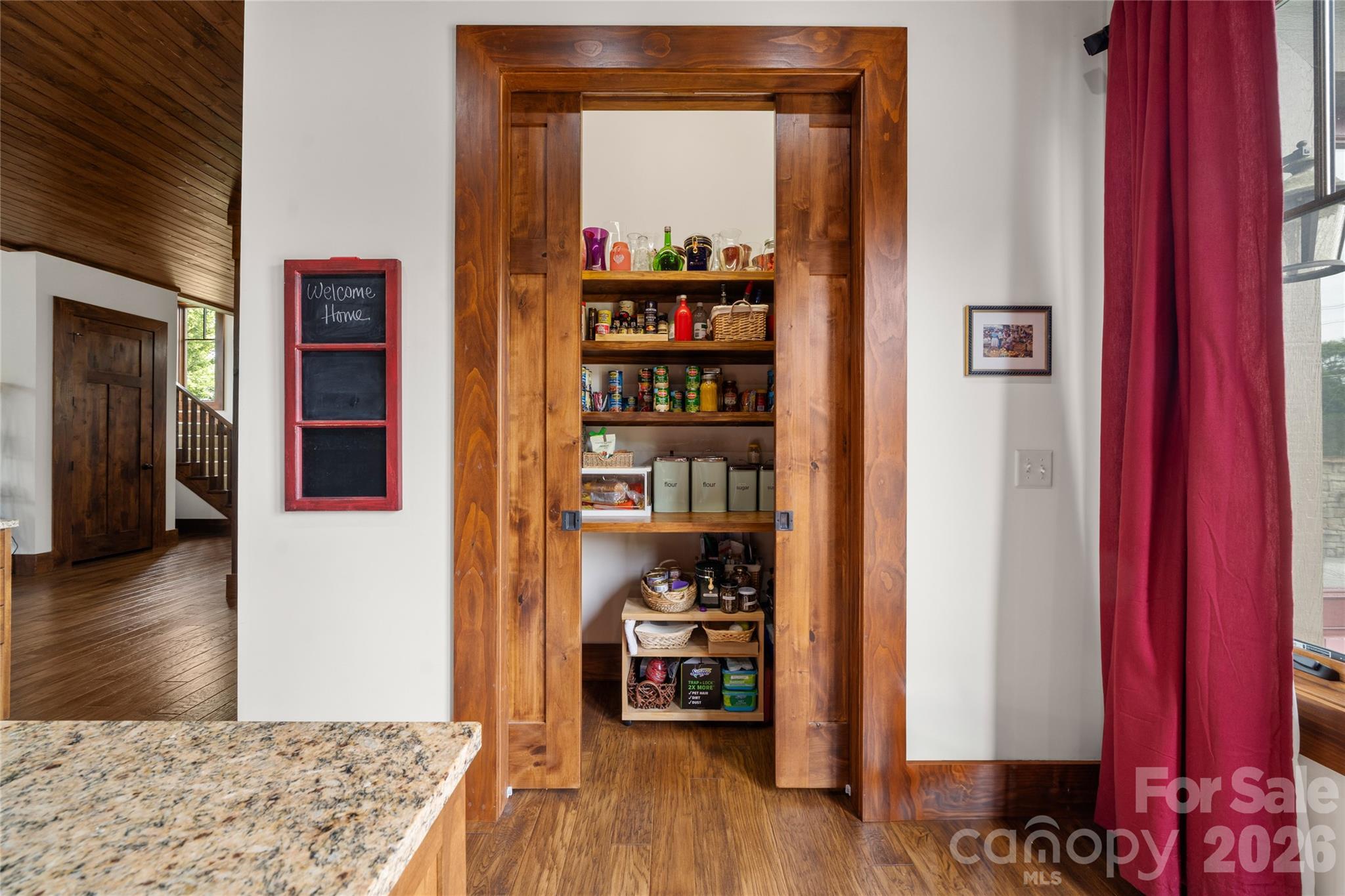 4862 Pinnacle Mountain Road Zirconia, NC 28790 - Photo 17 of 38 a area with lots of books and knick knacks on it