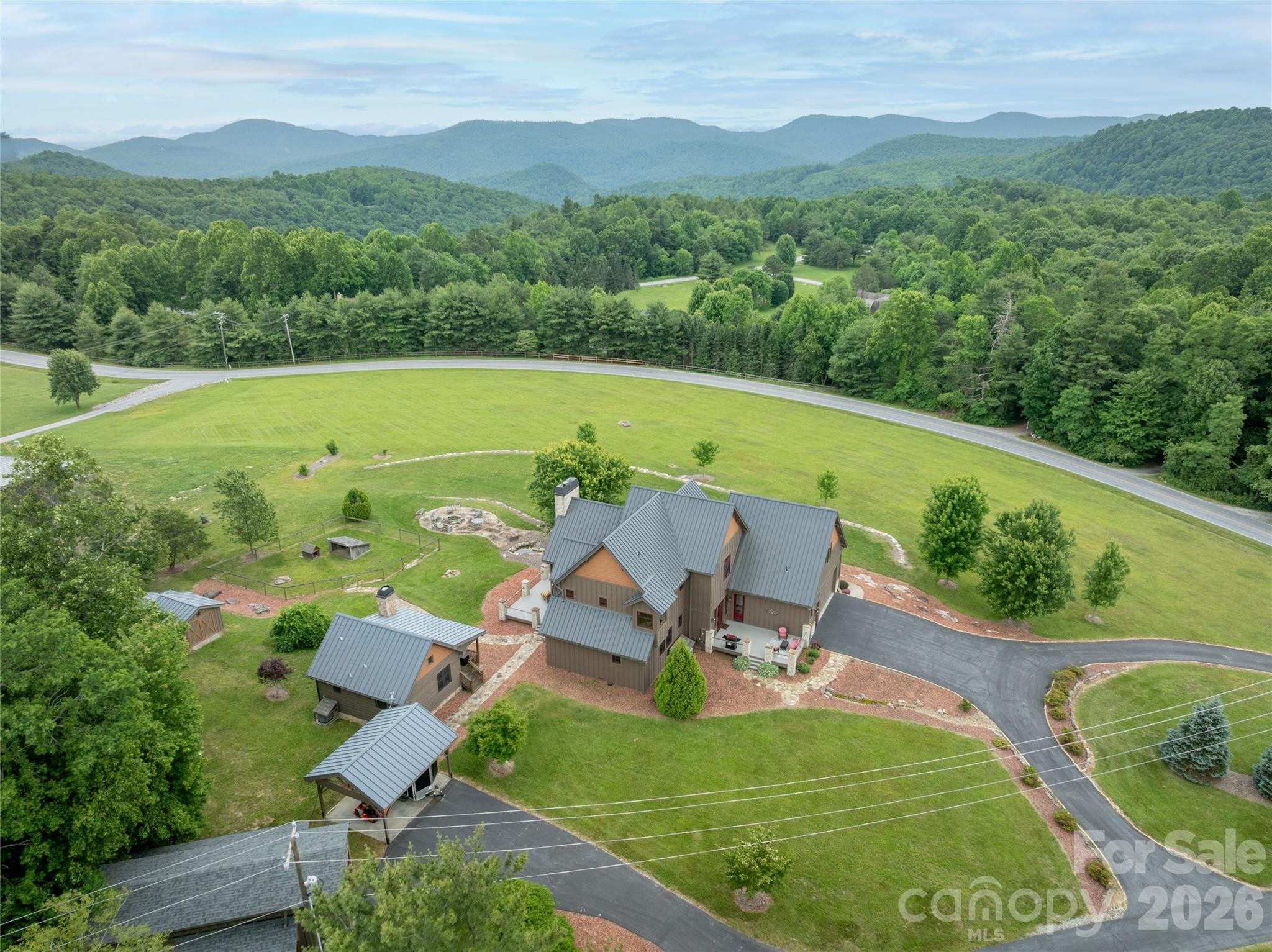 4862 Pinnacle Mountain Road Zirconia, NC 28790 - Photo 2 of 38 a view of a swimming pool with a patio