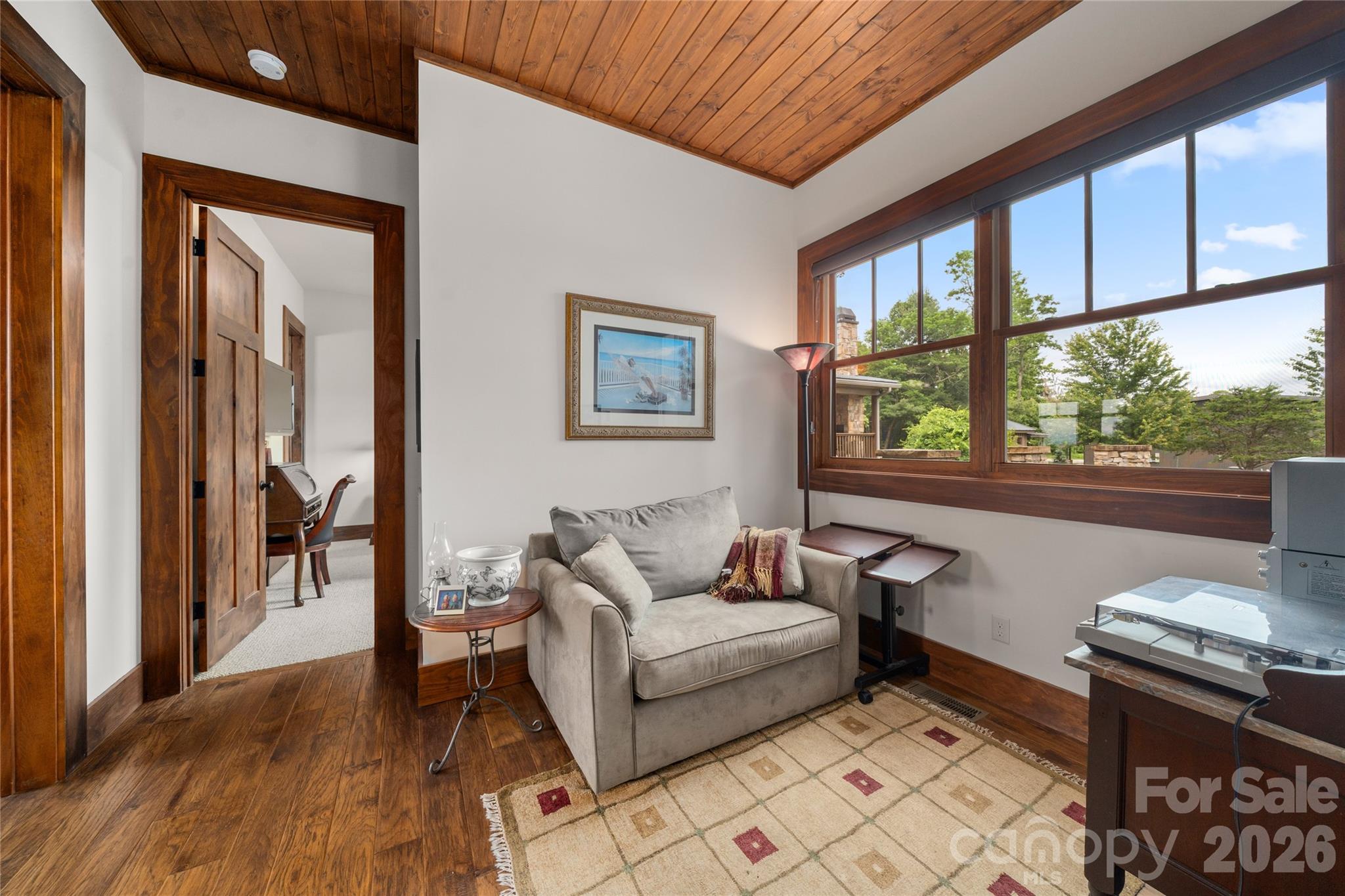 4862 Pinnacle Mountain Road Zirconia, NC 28790 - Photo 22 of 38 a living room with furniture and a window