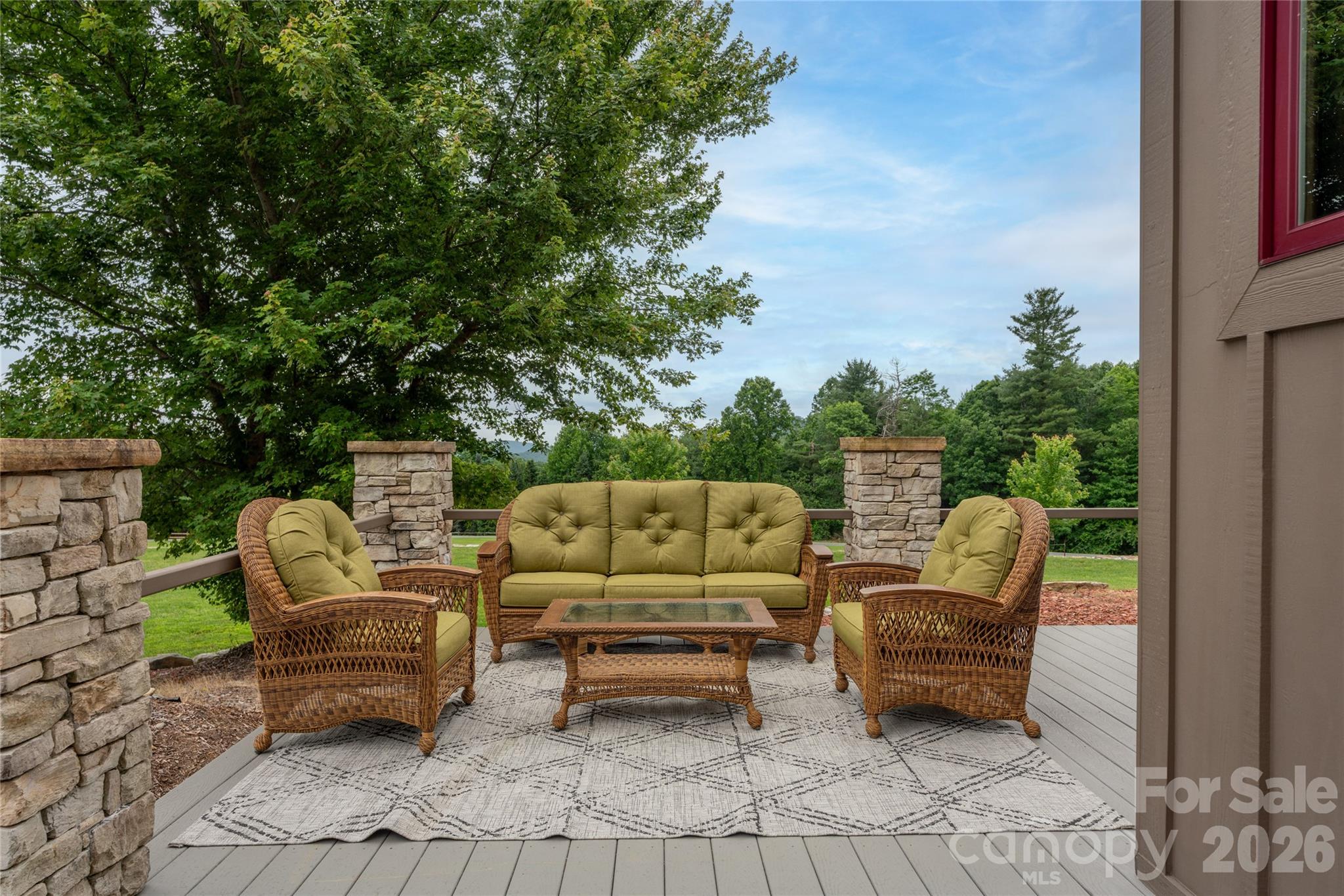 4862 Pinnacle Mountain Road Zirconia, NC 28790 - Photo 26 of 38 a roof deck with couches and potted plants