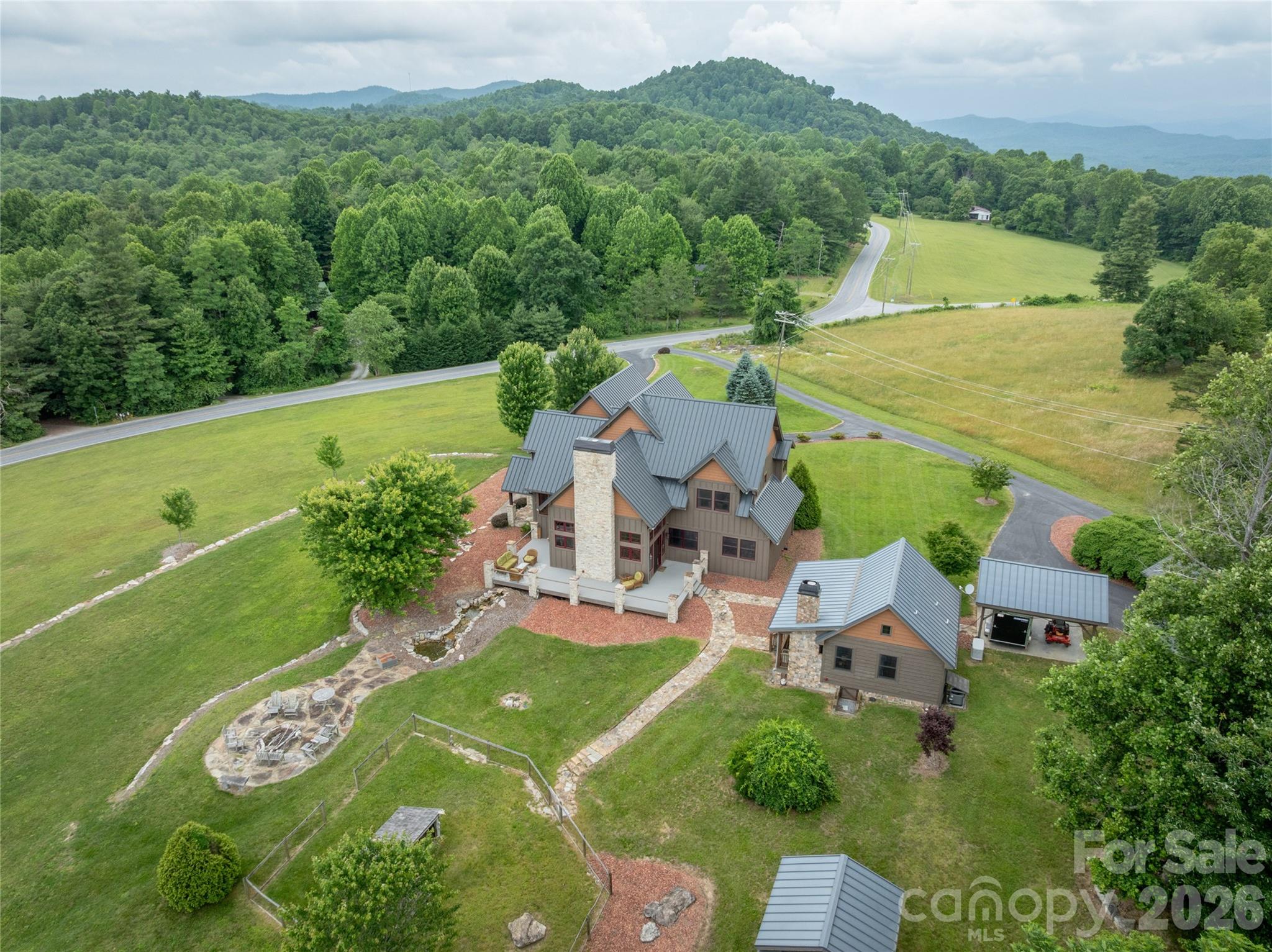 4862 Pinnacle Mountain Road Zirconia, NC 28790 - Photo 38 of 38 an aerial view of a house with a garden