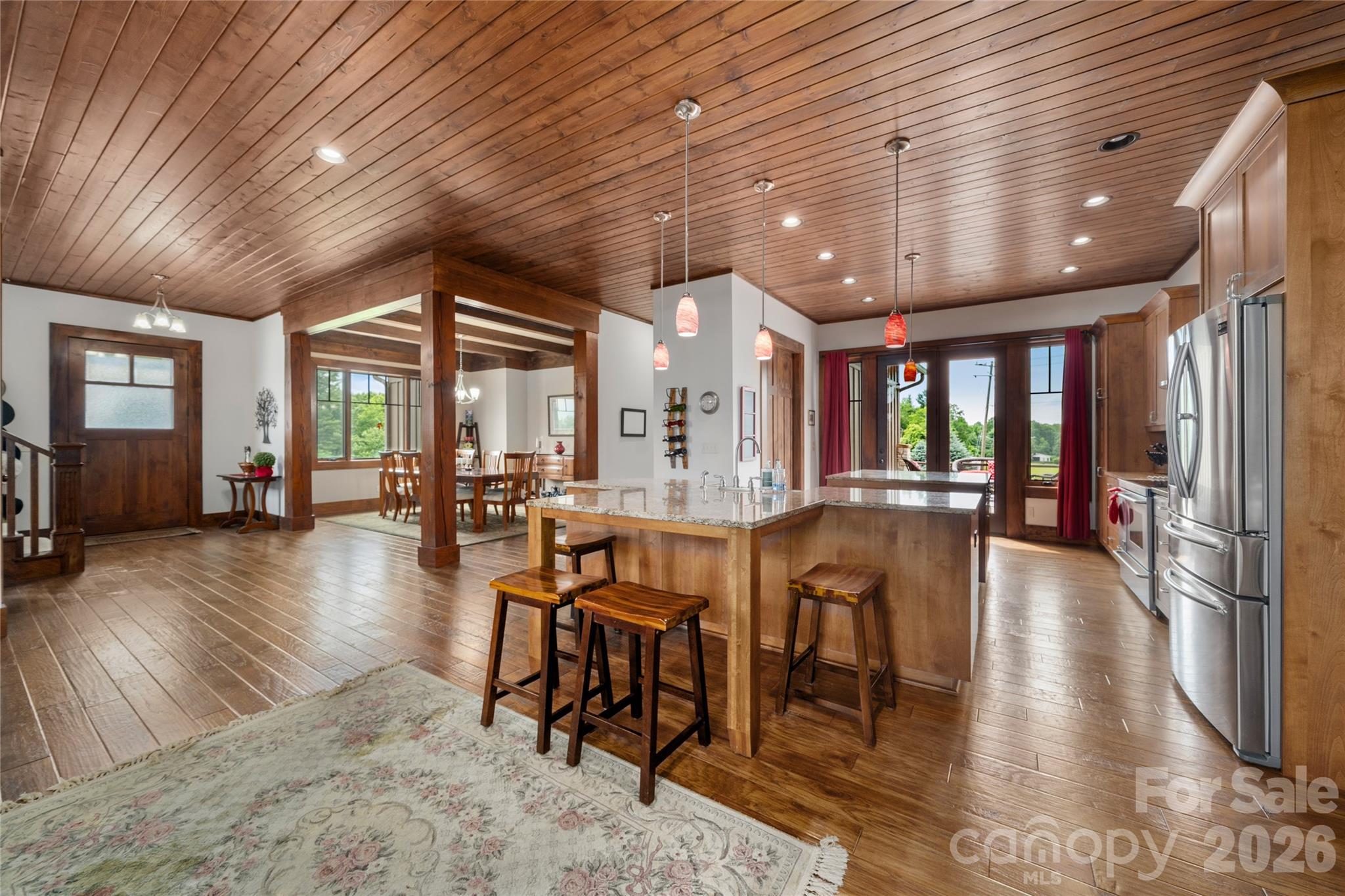 4862 Pinnacle Mountain Road Zirconia, NC 28790 - Photo 5 of 38 a view of a dining room with furniture window and wooden floor