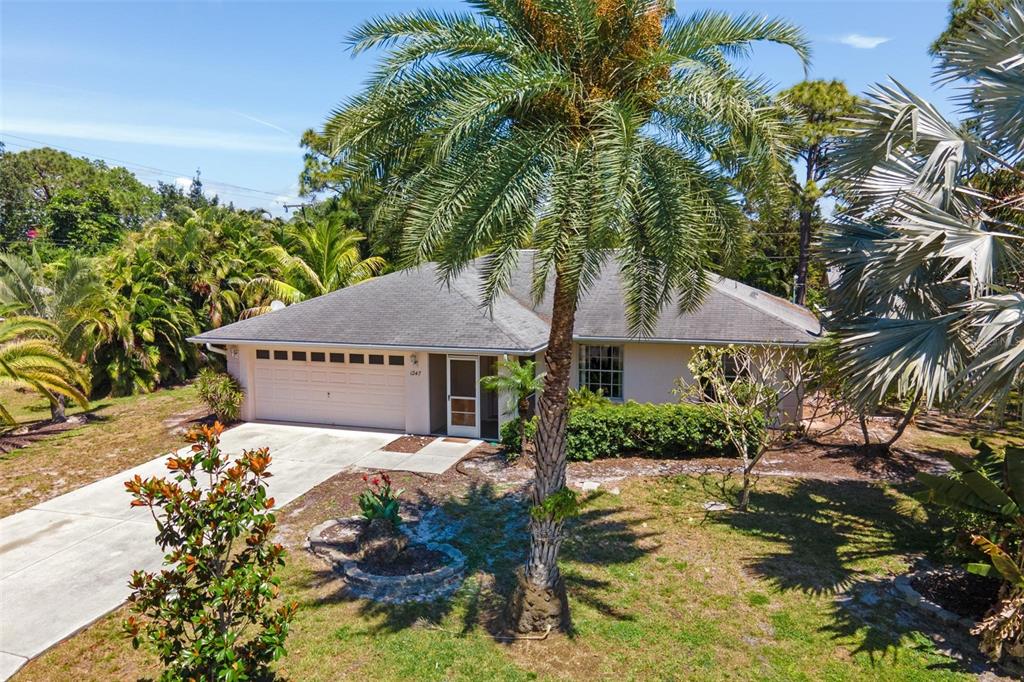 1247 Piedmont Road Venice, FL 34293 - Photo 1 of 1 a view of a house with a yard and sitting area