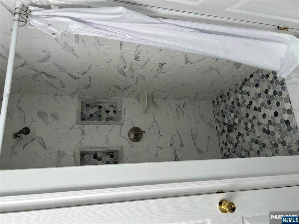 829 Main Street, Unit 2 Hackensack, NJ 07601 - Photo 2 of 8 a bathroom with a shower
