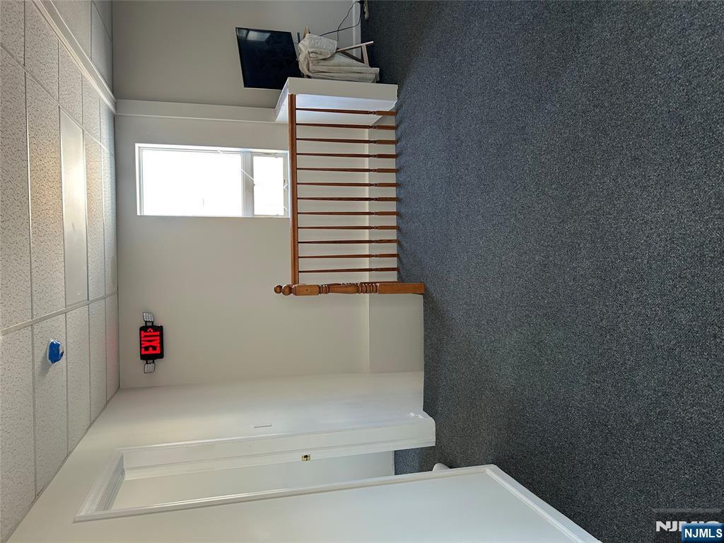 829 Main Street, Unit 2 Hackensack, NJ 07601 - Photo 4 of 8 a view of an empty room with a window